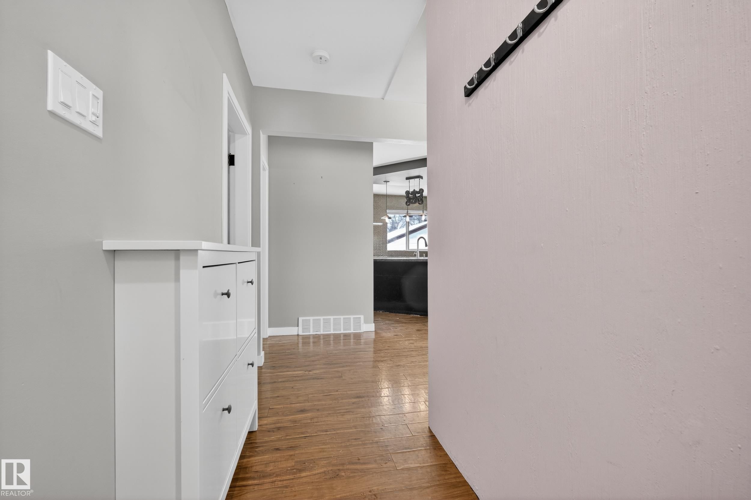 This entryway features light gray walls and hardwood flooring - 3613 113 Avenue, Edmonton, AB - Indoor Photo Showing Other Room