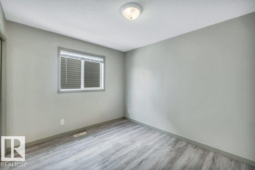This room features light grey walls and light-toned flooring - 902 Graham Wynd, Edmonton, AB - Indoor Photo Showing Other Room