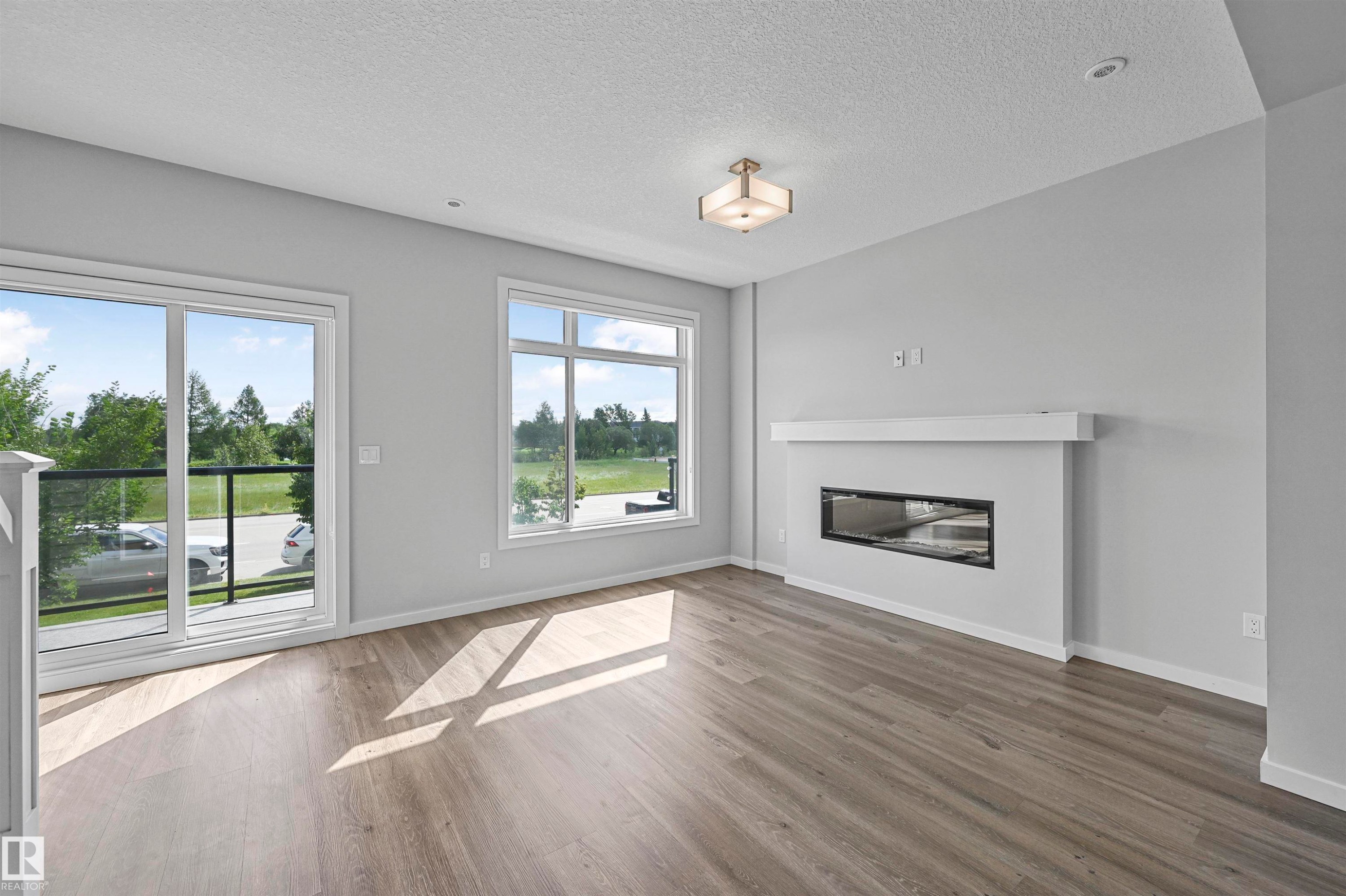 72 1010 Rabbit Hill Road, Edmonton, AB - Indoor Photo Showing Living Room With Fireplace