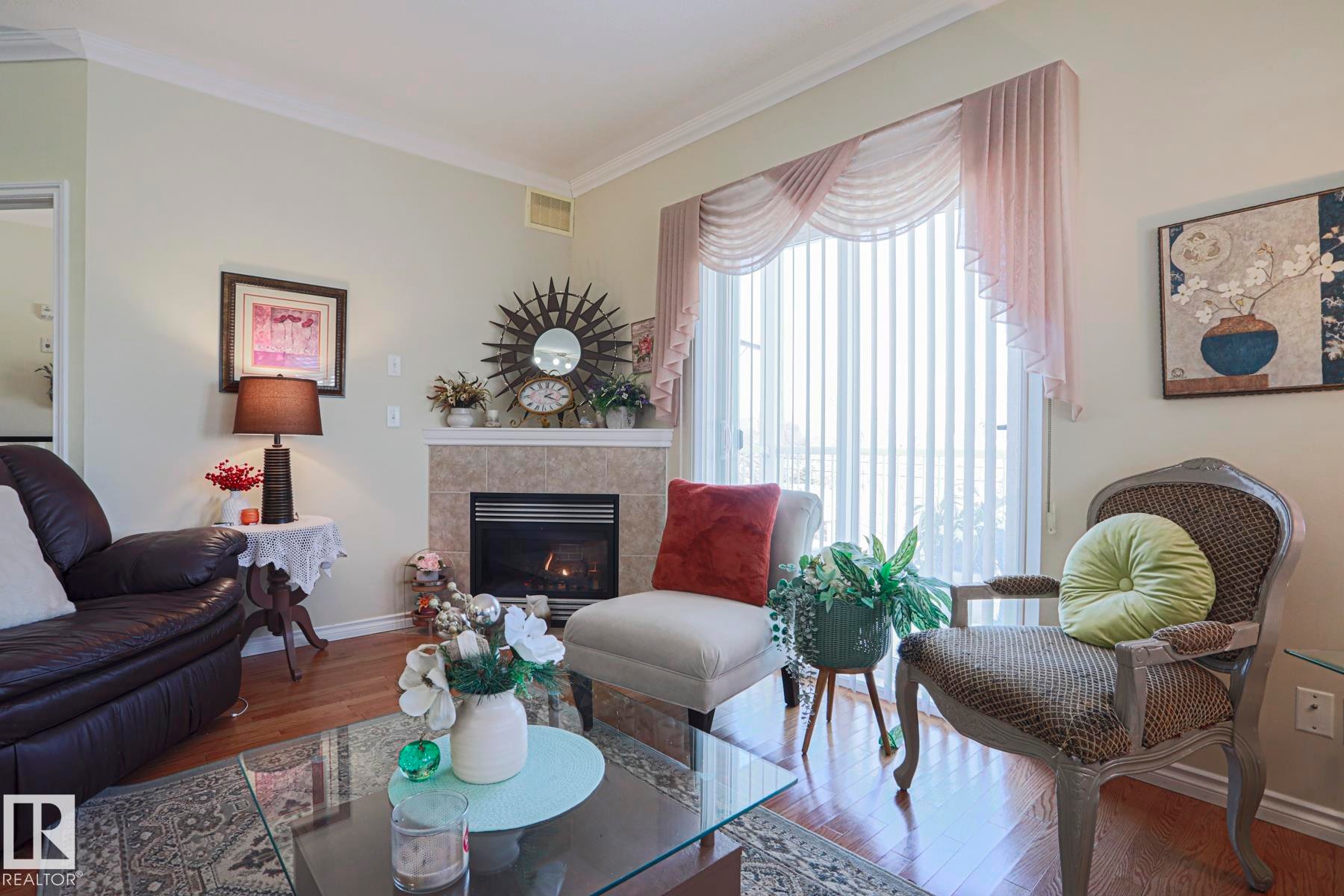 314 8528 82 Avenue, Edmonton, AB - Indoor Photo Showing Living Room With Fireplace