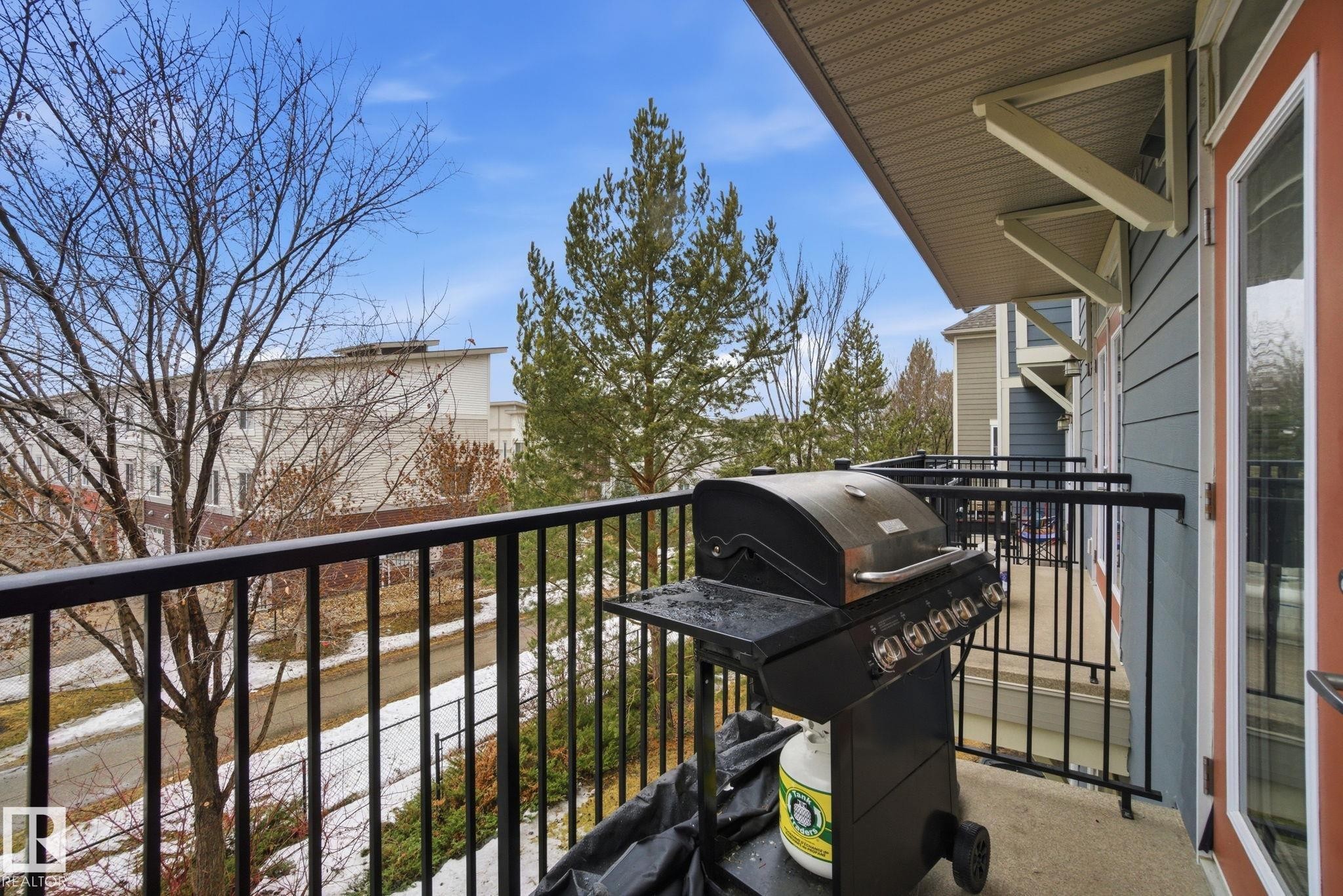 The property features a private balcony with a dark metal railing, offering space for outdoor entertaining - 75 603 Watt Boulevard, Edmonton, AB - Outdoor With Balcony With Exterior