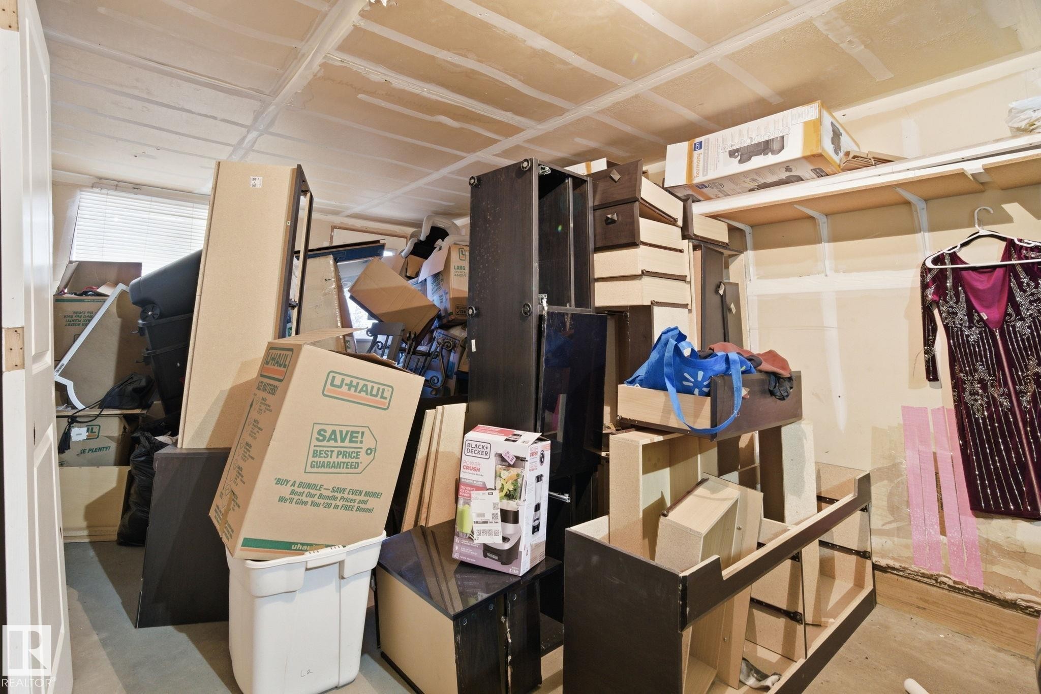 The property features a room with a window, a partial door frame, and exposed ceiling joists - 75 603 Watt Boulevard, Edmonton, AB - Indoor