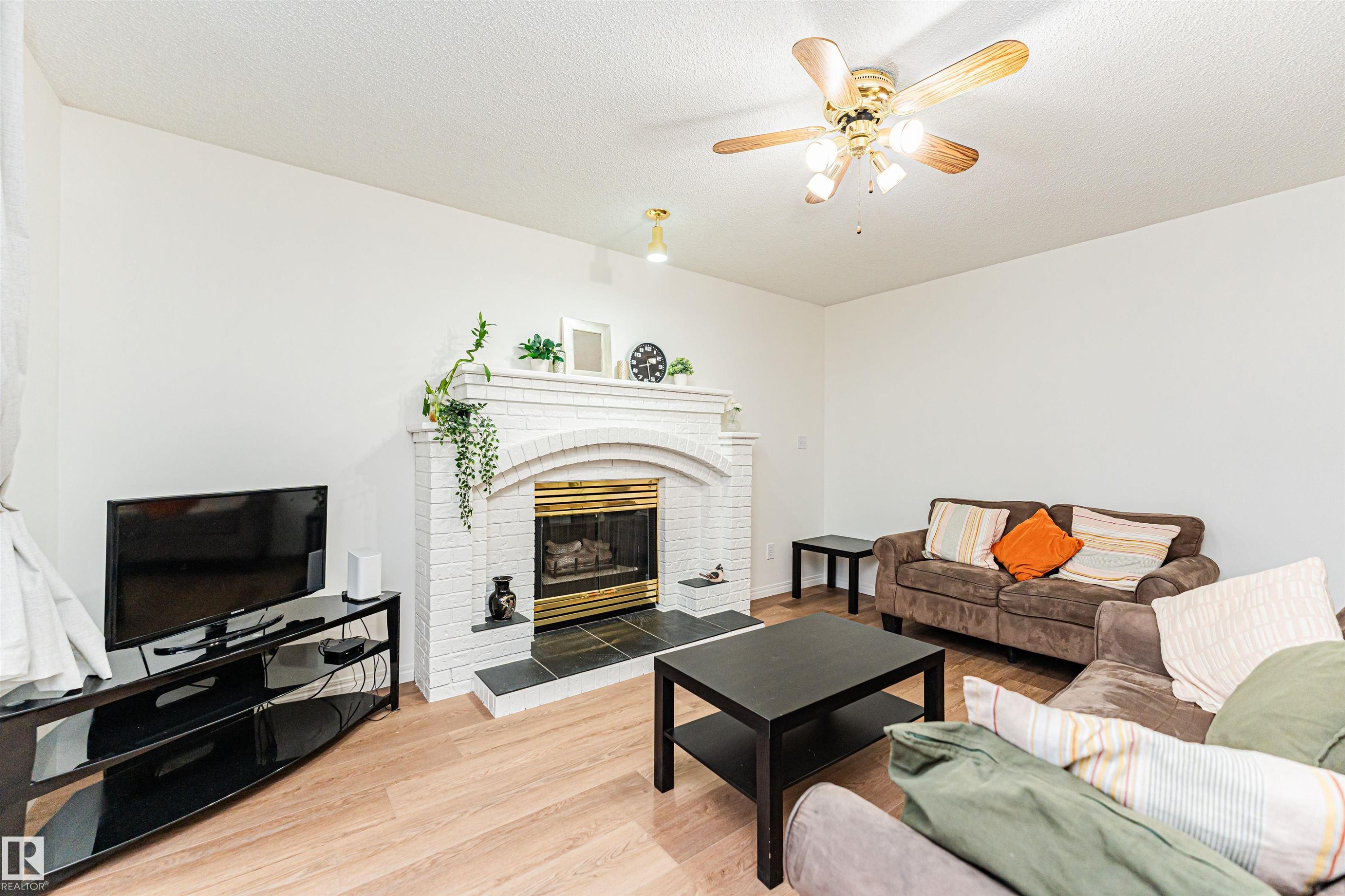 4424 33 Street, Edmonton, AB - Indoor Photo Showing Living Room With Fireplace