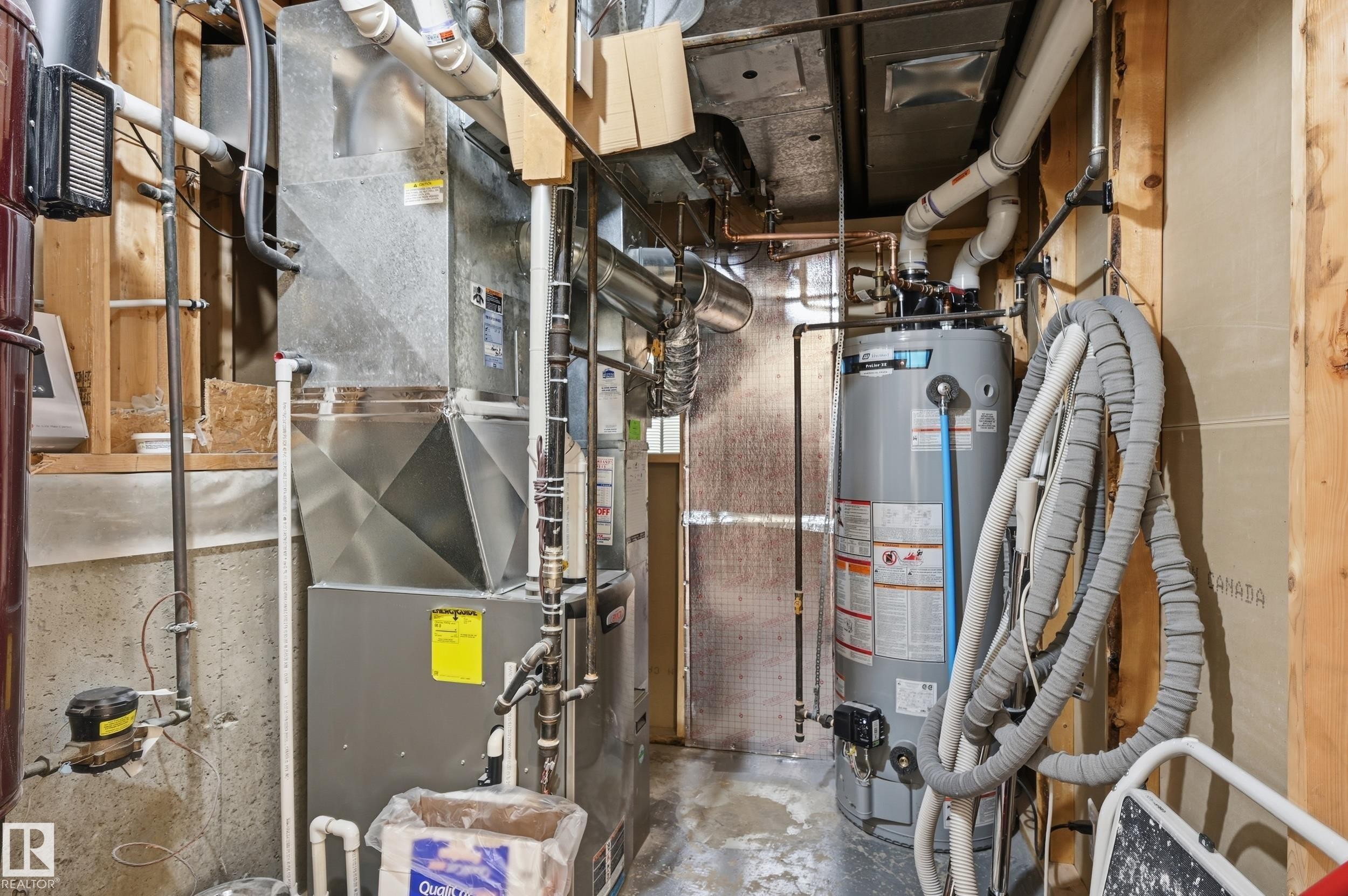 Utility room featuring a water heater and furnace unit - 85 Arlington Drive, St. Albert, AB - Indoor Photo Showing Basement