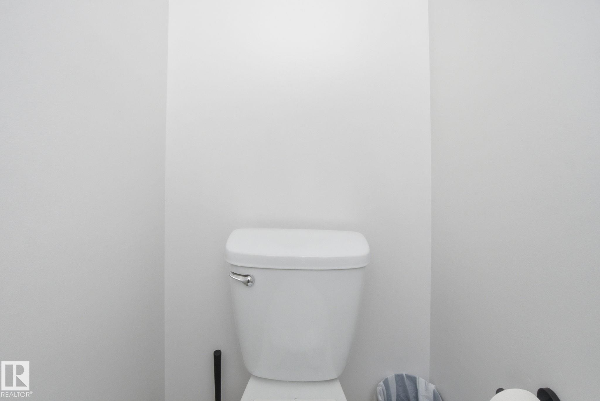 The bathroom features a white toilet - 29 9619 180 Street, Edmonton, AB - Indoor Photo Showing Bathroom