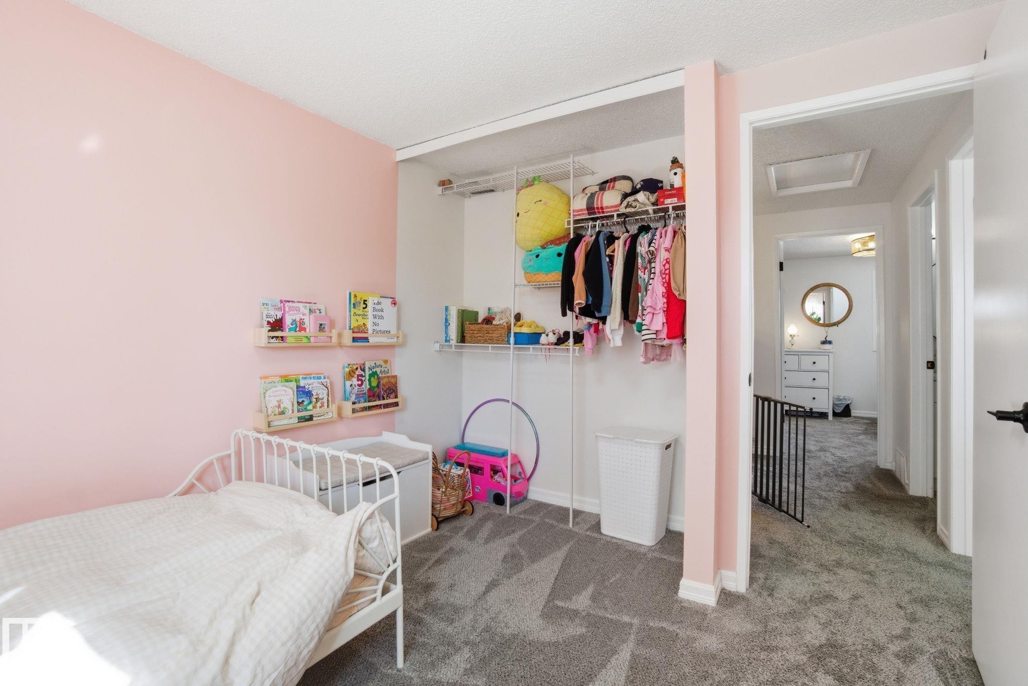 The room features plush gray carpeting and a built-in closet with shelving and hanging space - 29 9619 180 Street, Edmonton, AB - Indoor Photo Showing Bedroom