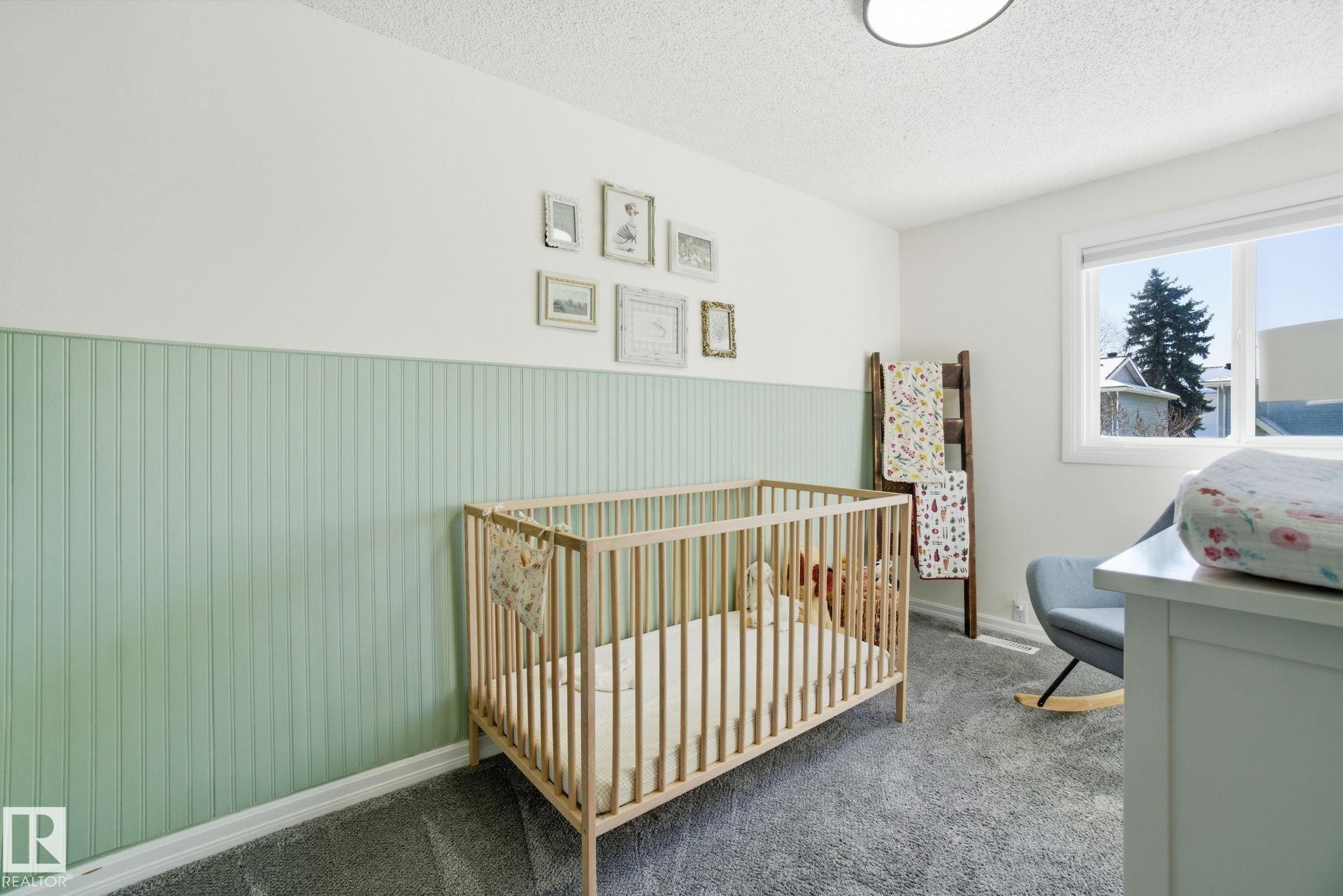 Bedroom featuring light green wainscoting, white walls, and grey carpeting - 29 9619 180 Street, Edmonton, AB - Indoor Photo Showing Bedroom