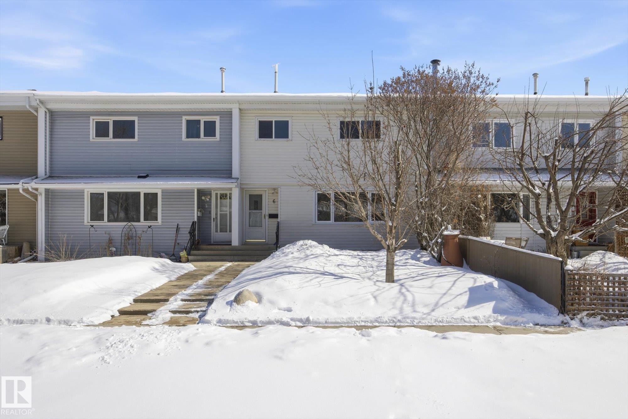 The property features a two-story exterior with light-colored siding - 6 Garden Crescent, St. Albert, AB - Outdoor With Facade