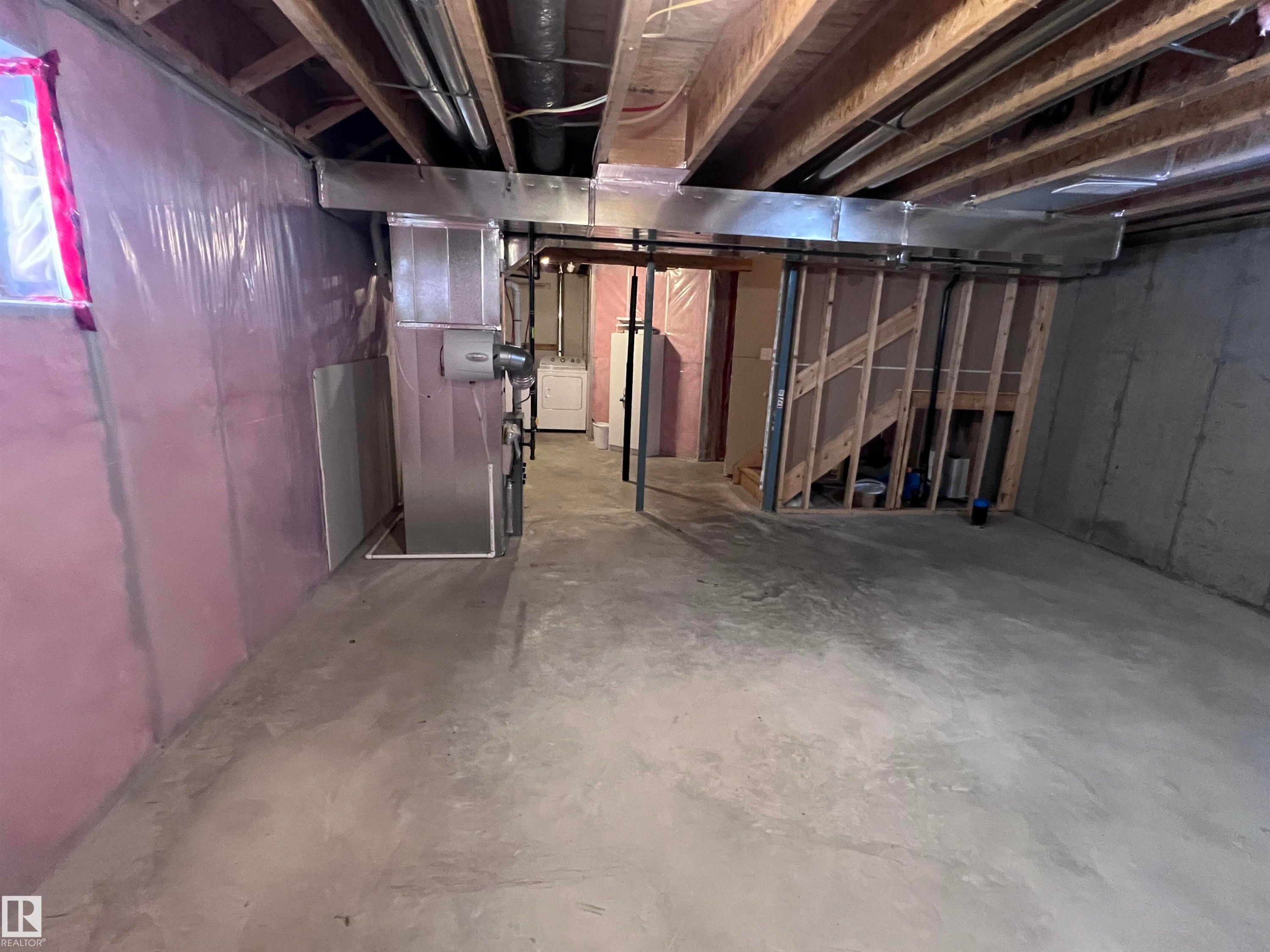 The property features an unfinished basement with exposed wooden joists and concrete flooring - 1421 26 Avenue, Edmonton, AB - Indoor Photo Showing Basement