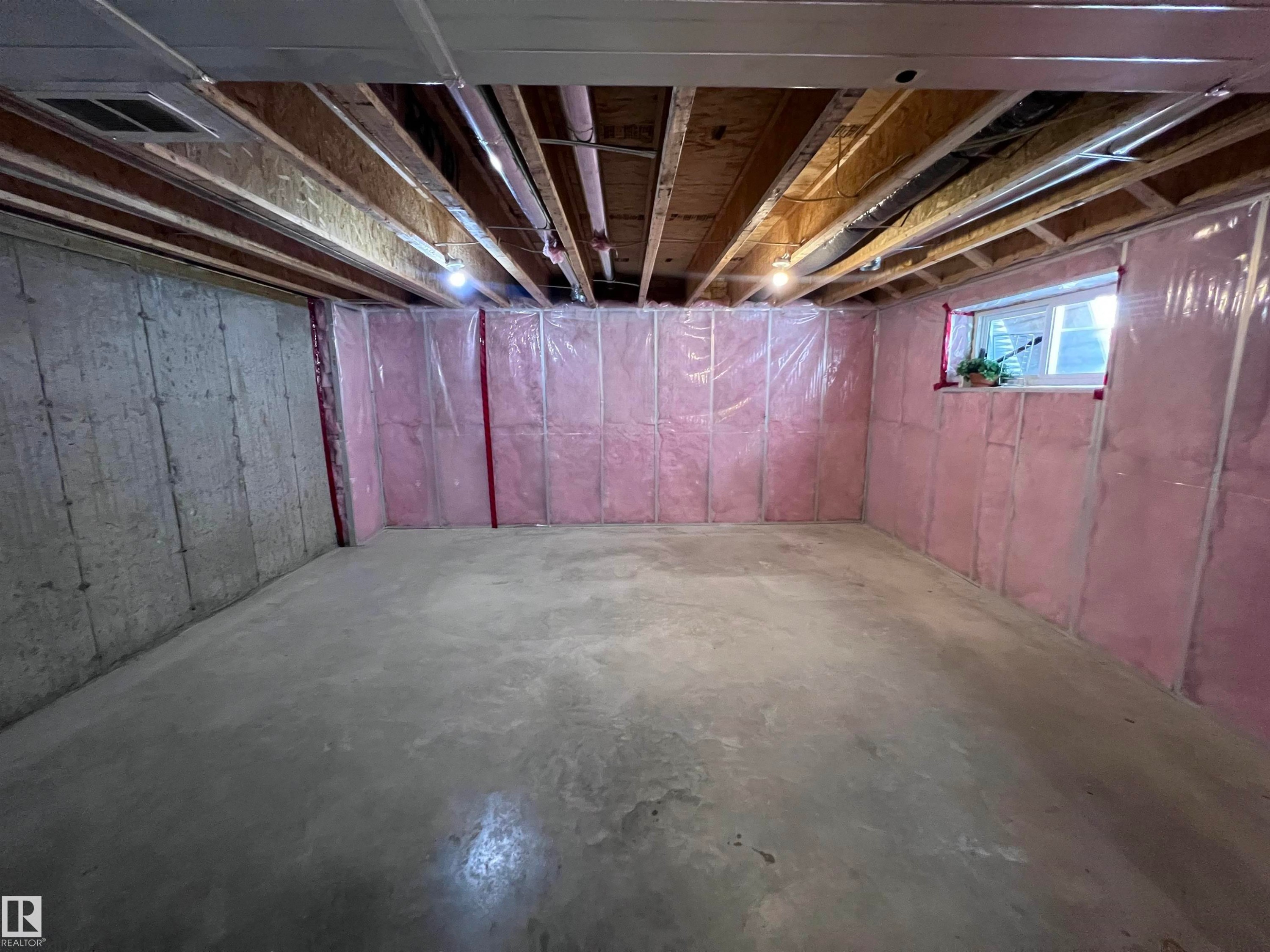 Kitchen featuring a stainless steel French door refrigerator, dark wood flooring, and a white interior door - 1421 26 Avenue, Edmonton, AB - Indoor Photo Showing Basement