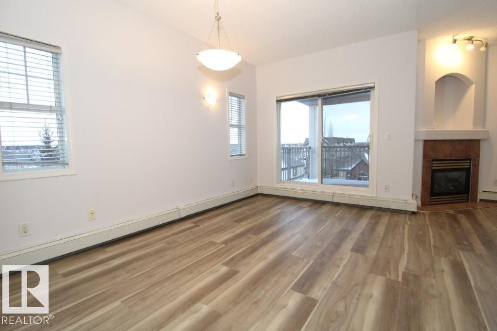 414 5280 Terwillegar Boulevard, Edmonton, AB - Indoor With Fireplace
