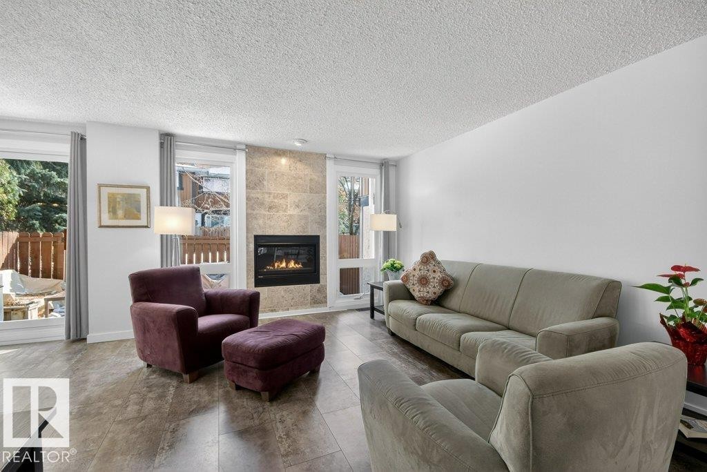 91 Hearthstone, Edmonton, AB - Indoor Photo Showing Living Room With Fireplace