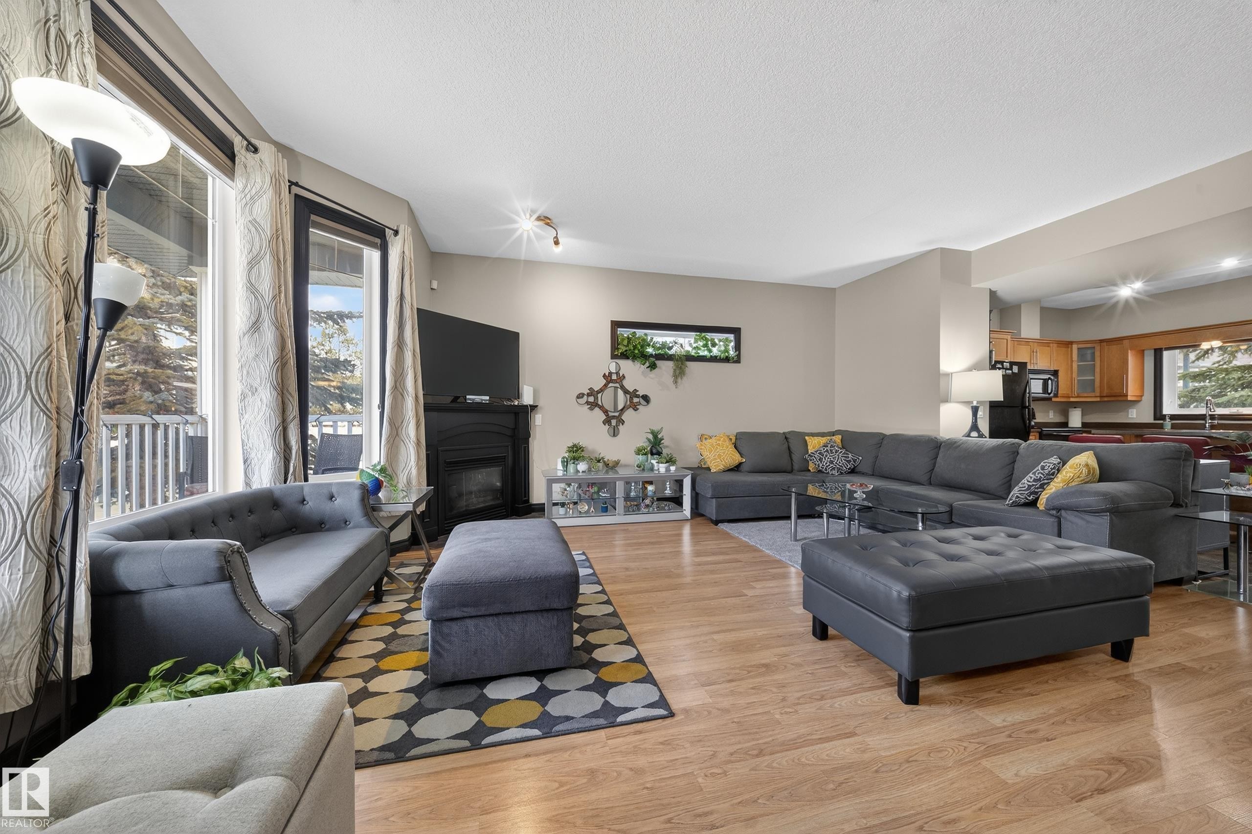 43 903 Rutherford Road, Edmonton, AB - Indoor Photo Showing Living Room With Fireplace