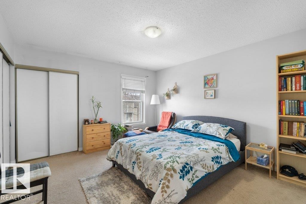 This room features light-colored walls and carpeted flooring - 638 Saddleback Road, Edmonton, AB - Indoor Photo Showing Bedroom