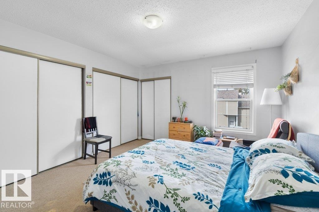 This room features light-colored walls and carpeting, offering a neutral palette - 638 Saddleback Road, Edmonton, AB - Indoor Photo Showing Bedroom