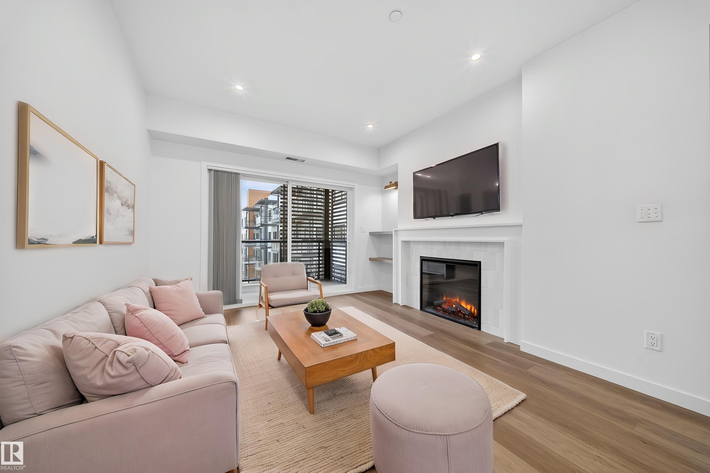 Virtually Staged - 301 7459 May Common, Edmonton, AB - Indoor Photo Showing Living Room With Fireplace