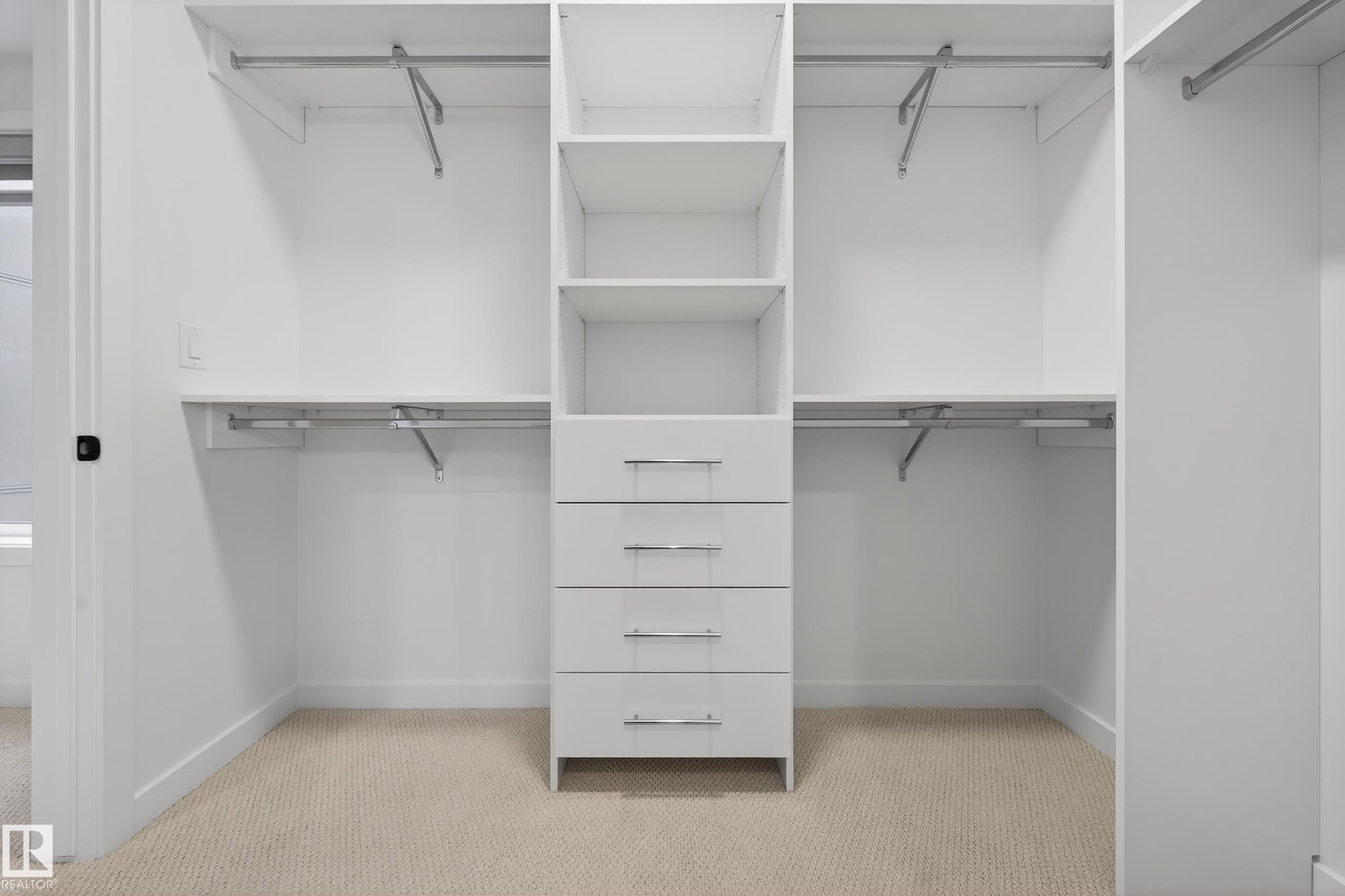 Primary WIC with Custom Cabinetry - 301 7459 May Common, Edmonton, AB - Indoor With Storage