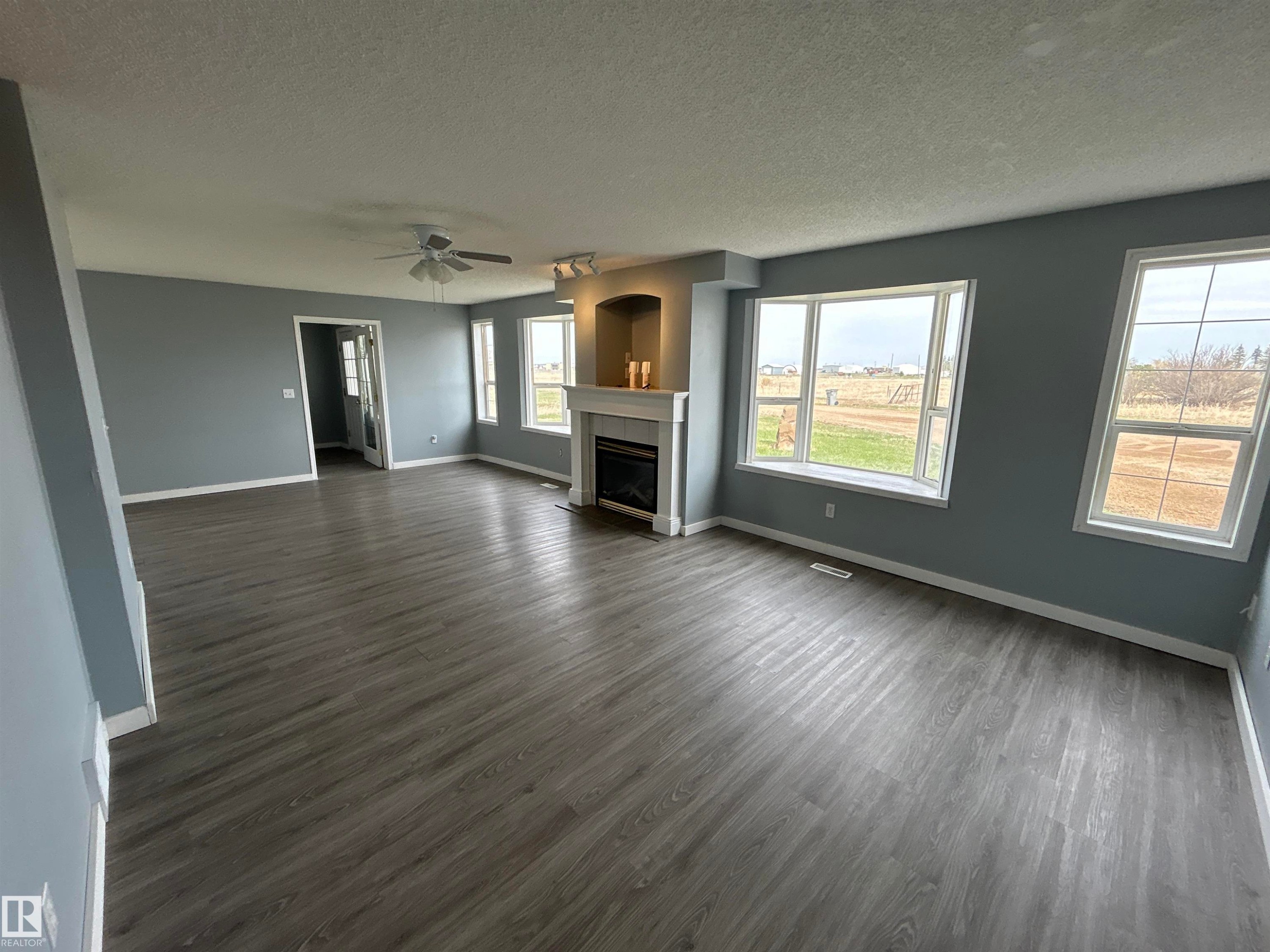 4420 50 Street, Rural Lamont County, AB - Indoor Photo Showing Living Room With Fireplace