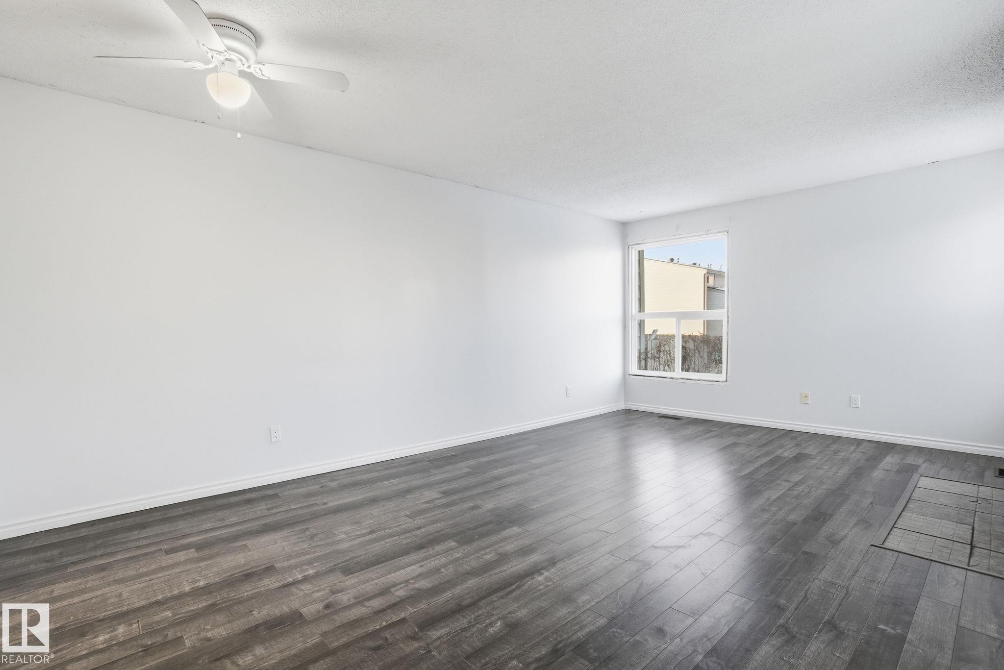1130 Knottwood Road E, Edmonton, AB - Indoor Photo Showing Living Room With Fireplace