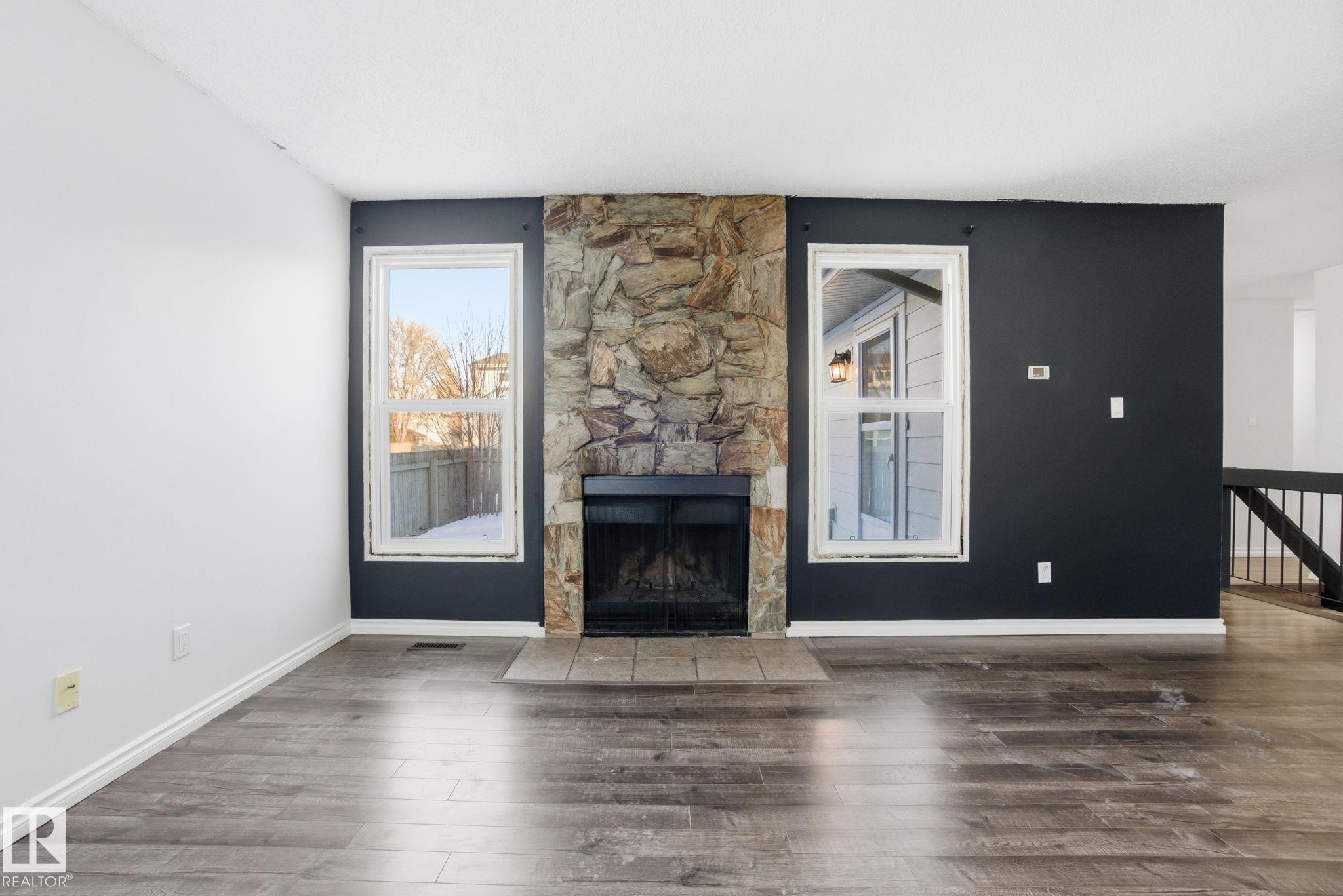 1130 Knottwood Road E, Edmonton, AB - Indoor Photo Showing Living Room With Fireplace