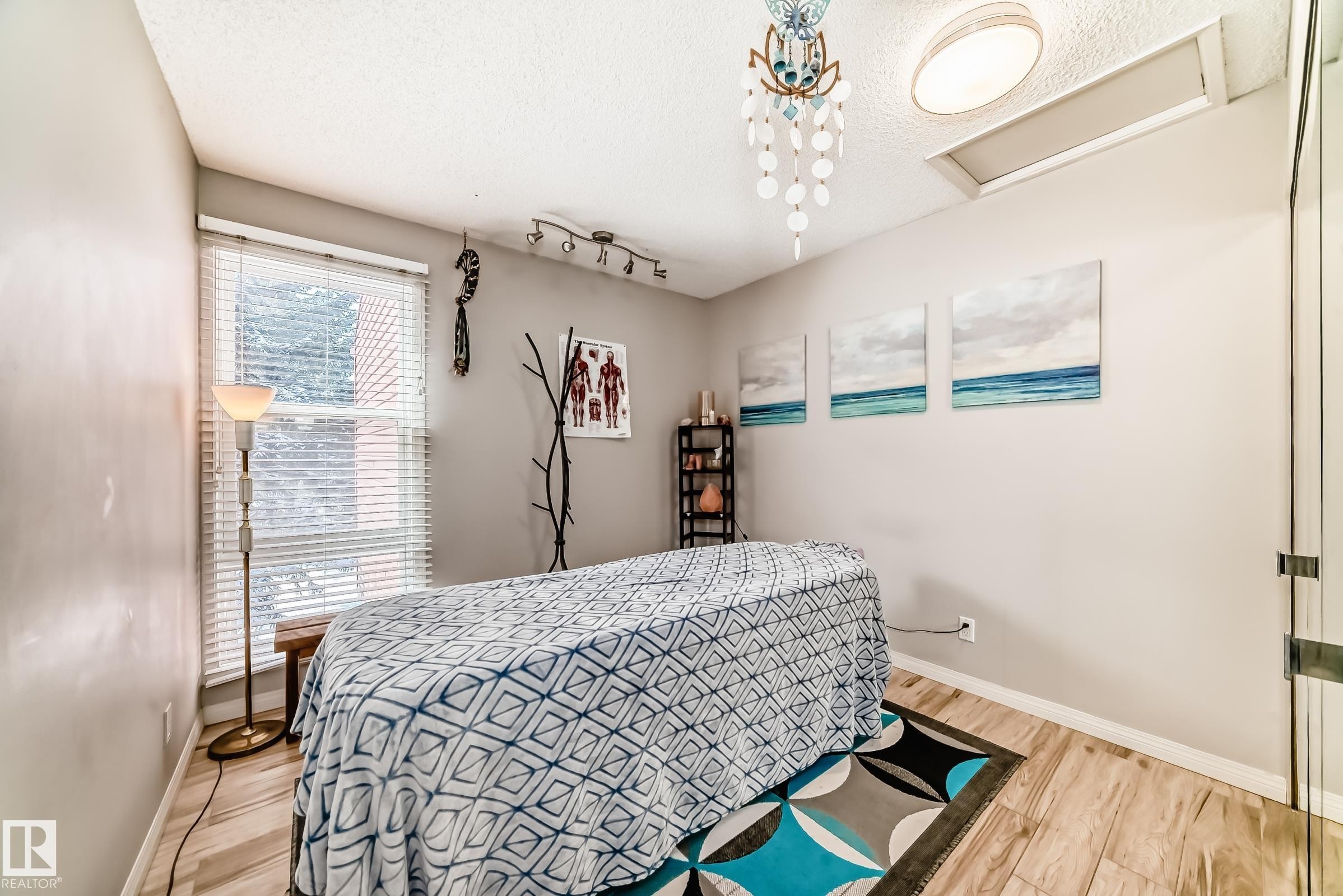 This room features light wood-style flooring, a window with blinds, and recessed lighting - 597 Millbourne Road E, Edmonton, AB - Indoor Photo Showing Bedroom