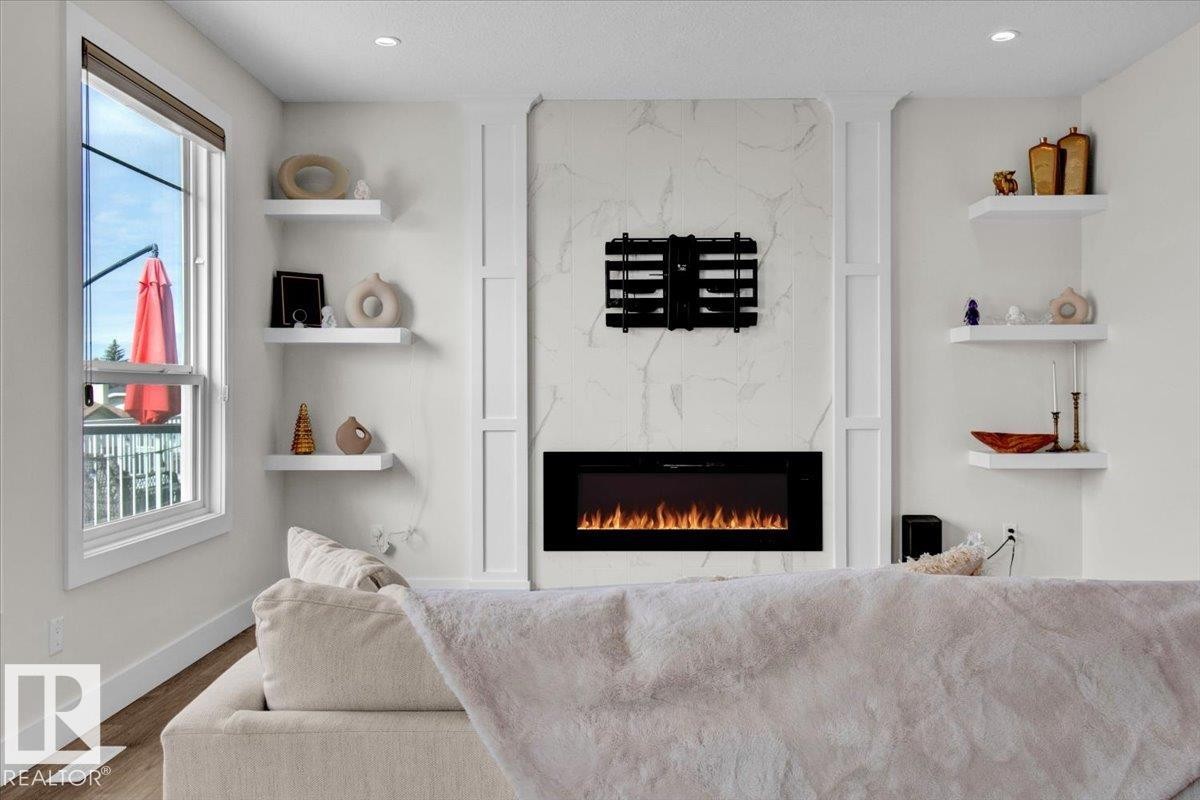 9327 181 Avenue, Edmonton, AB - Indoor Photo Showing Living Room With Fireplace