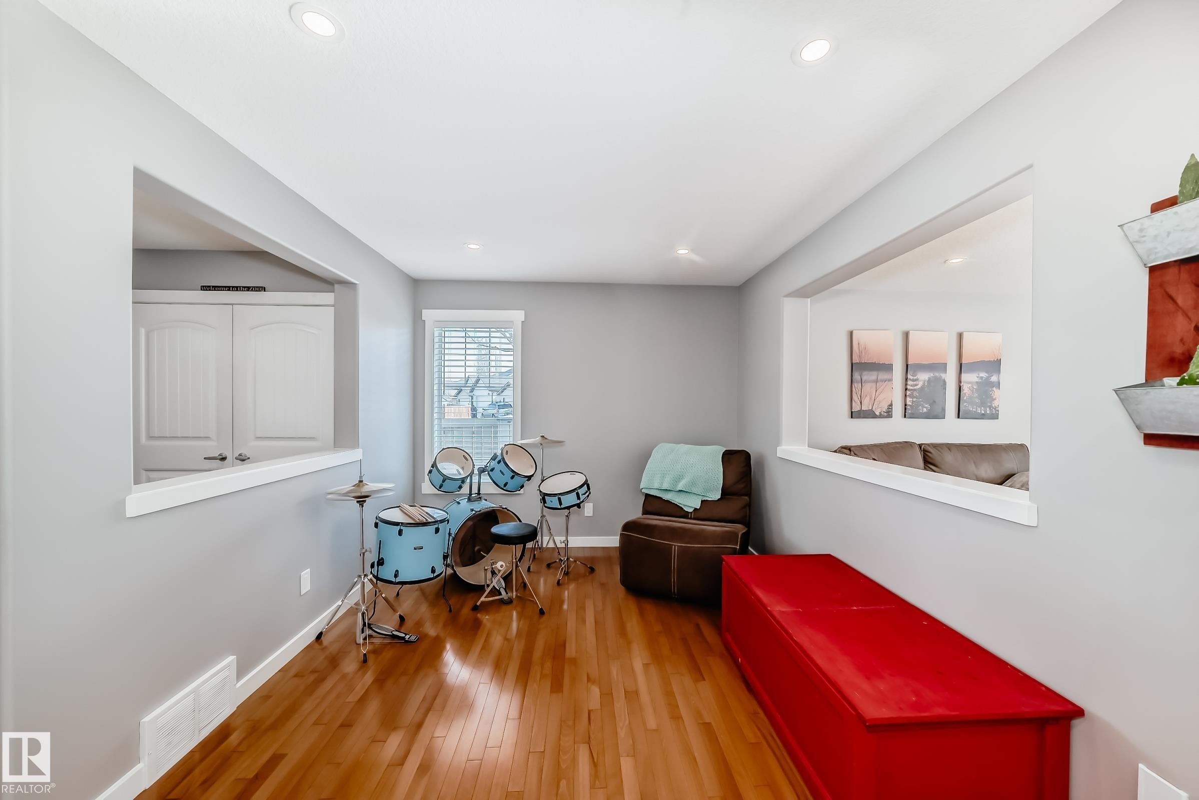 This room features hardwood floors and recessed lighting - 6303 2 Avenue, Edmonton, AB - Indoor Photo Showing Other Room