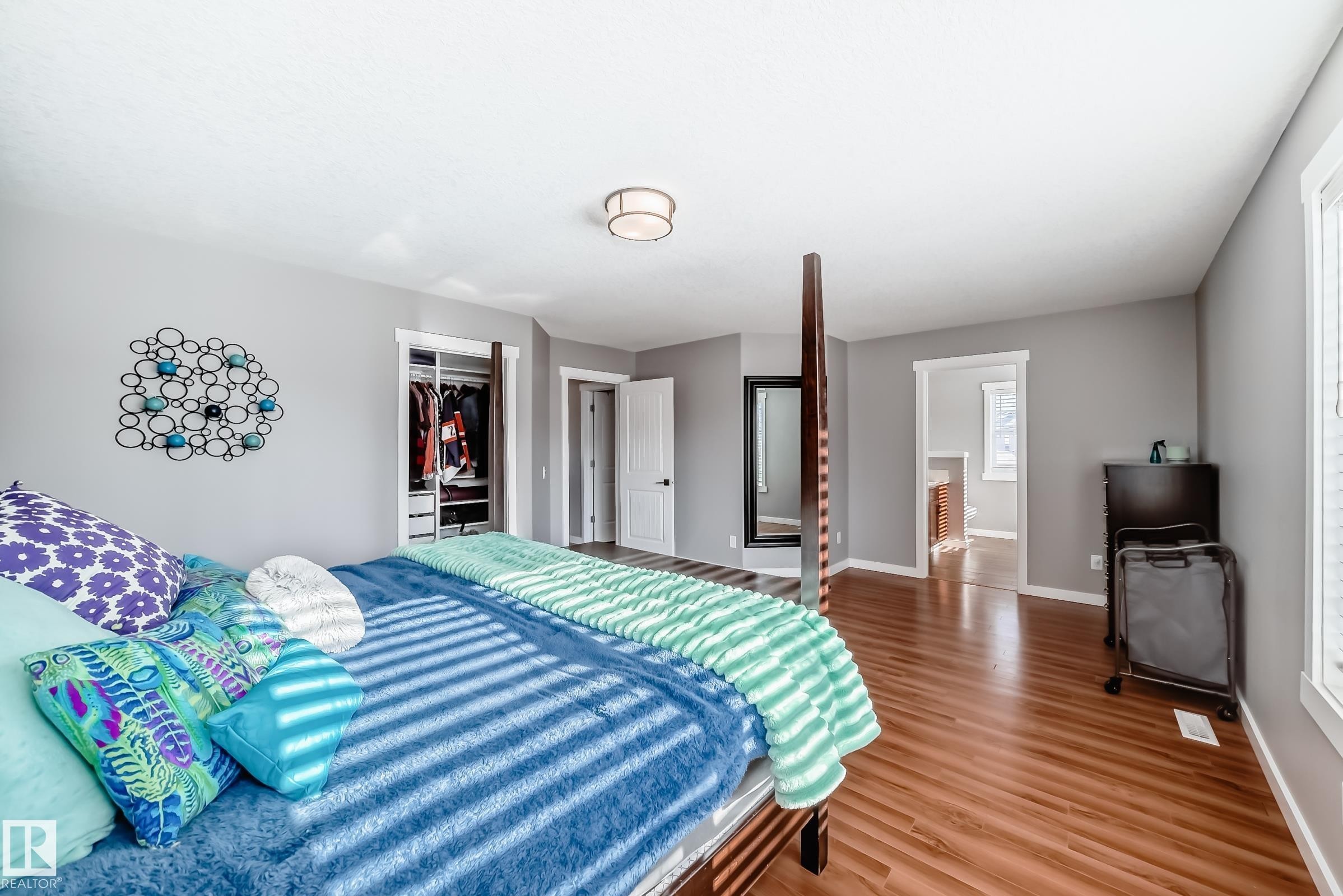 This room features light grey walls and wood flooring - 6303 2 Avenue, Edmonton, AB - Indoor Photo Showing Bedroom