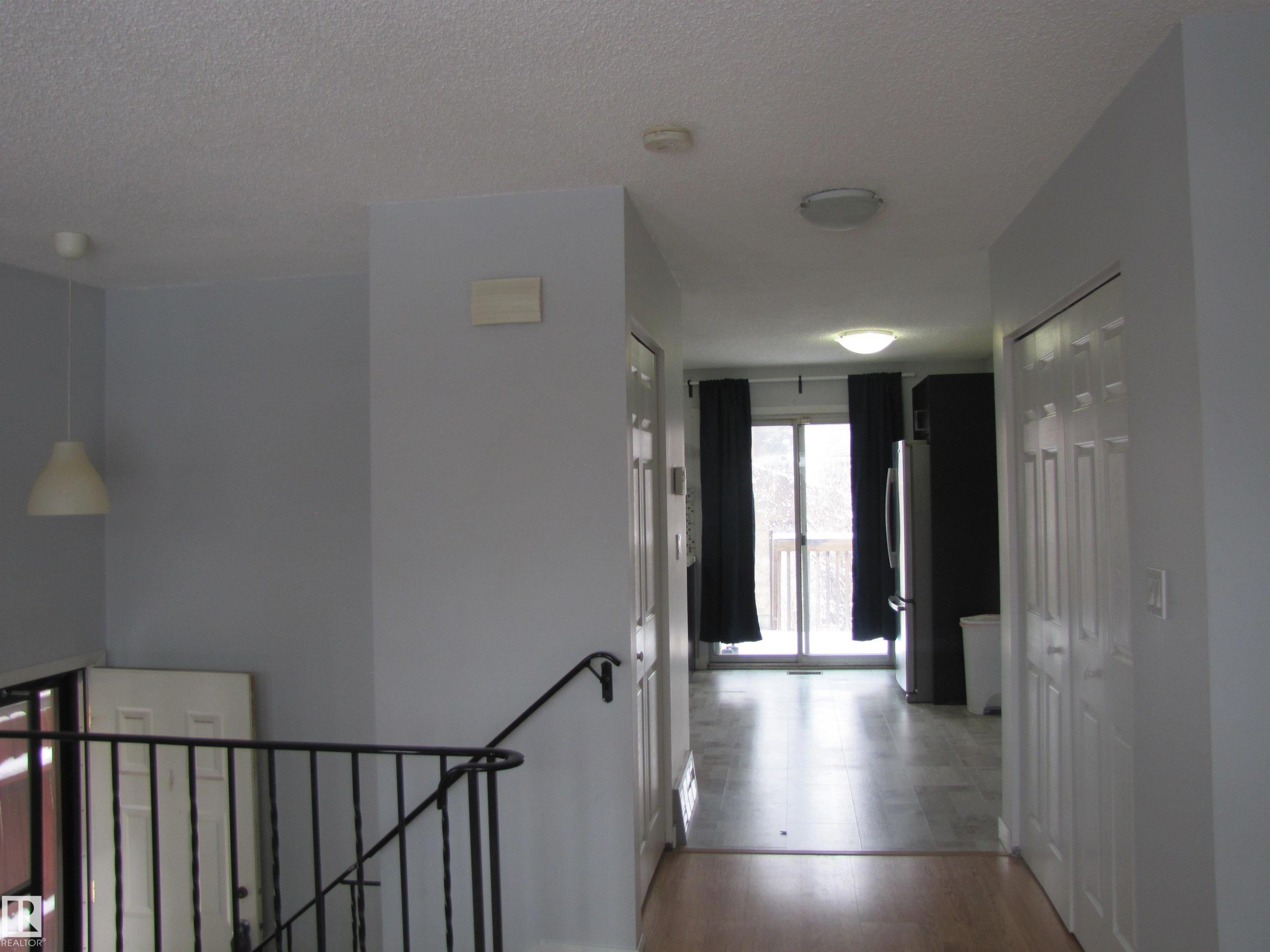 The property features light-colored walls and a blend of light wood and tiled flooring - 3617 43A Avenue, Edmonton, AB - Indoor Photo Showing Other Room