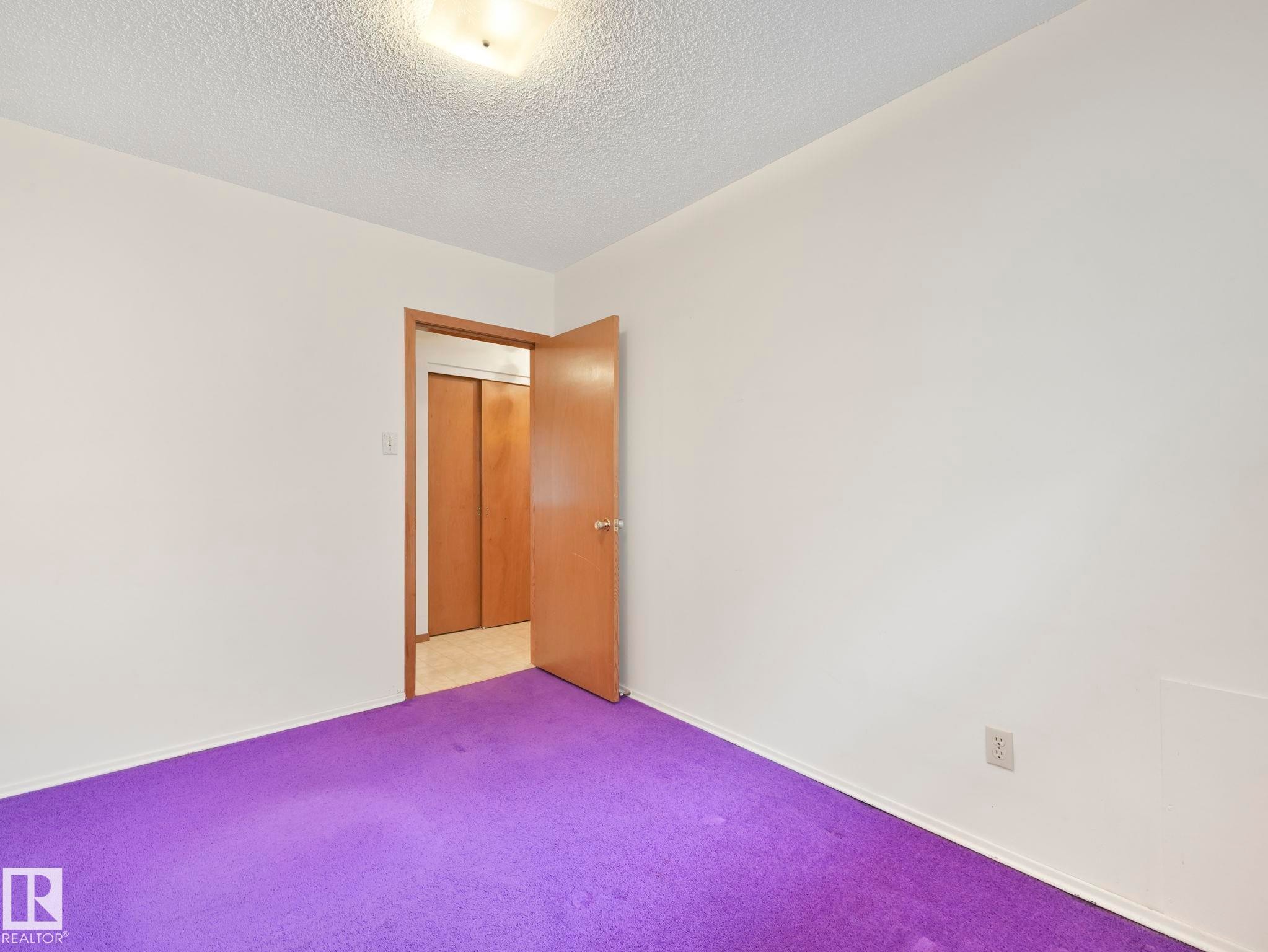 Room featuring white walls and purple carpet - 5904 84 Avenue, Edmonton, AB - Indoor Photo Showing Other Room