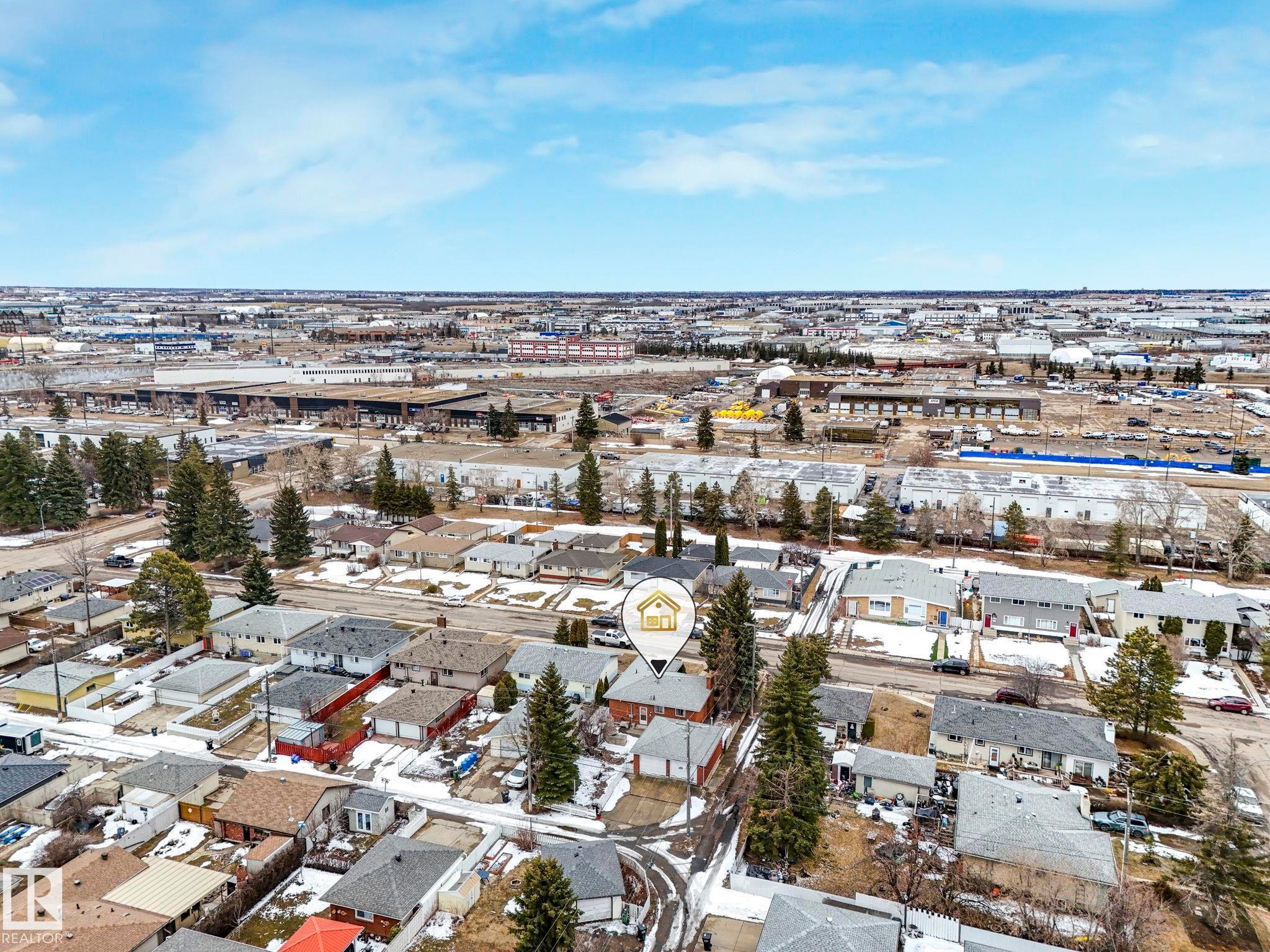 Aerial view showcasing the residential neighborhood with a variety of homes, featuring a mix of evergreen trees and bare deciduous trees - 5904 84 Avenue, Edmonton, AB - Outdoor With View