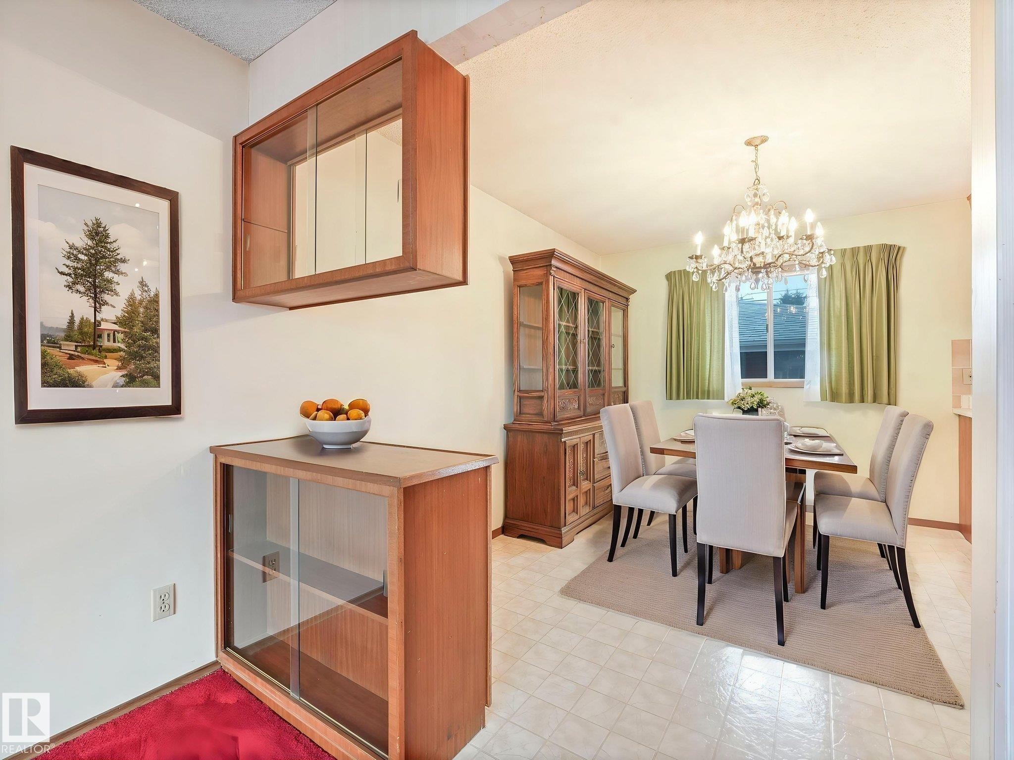 The dining area features a chandelier, tiled flooring, and a window with curtains - 5904 84 Avenue, Edmonton, AB - Indoor Photo Showing Dining Room