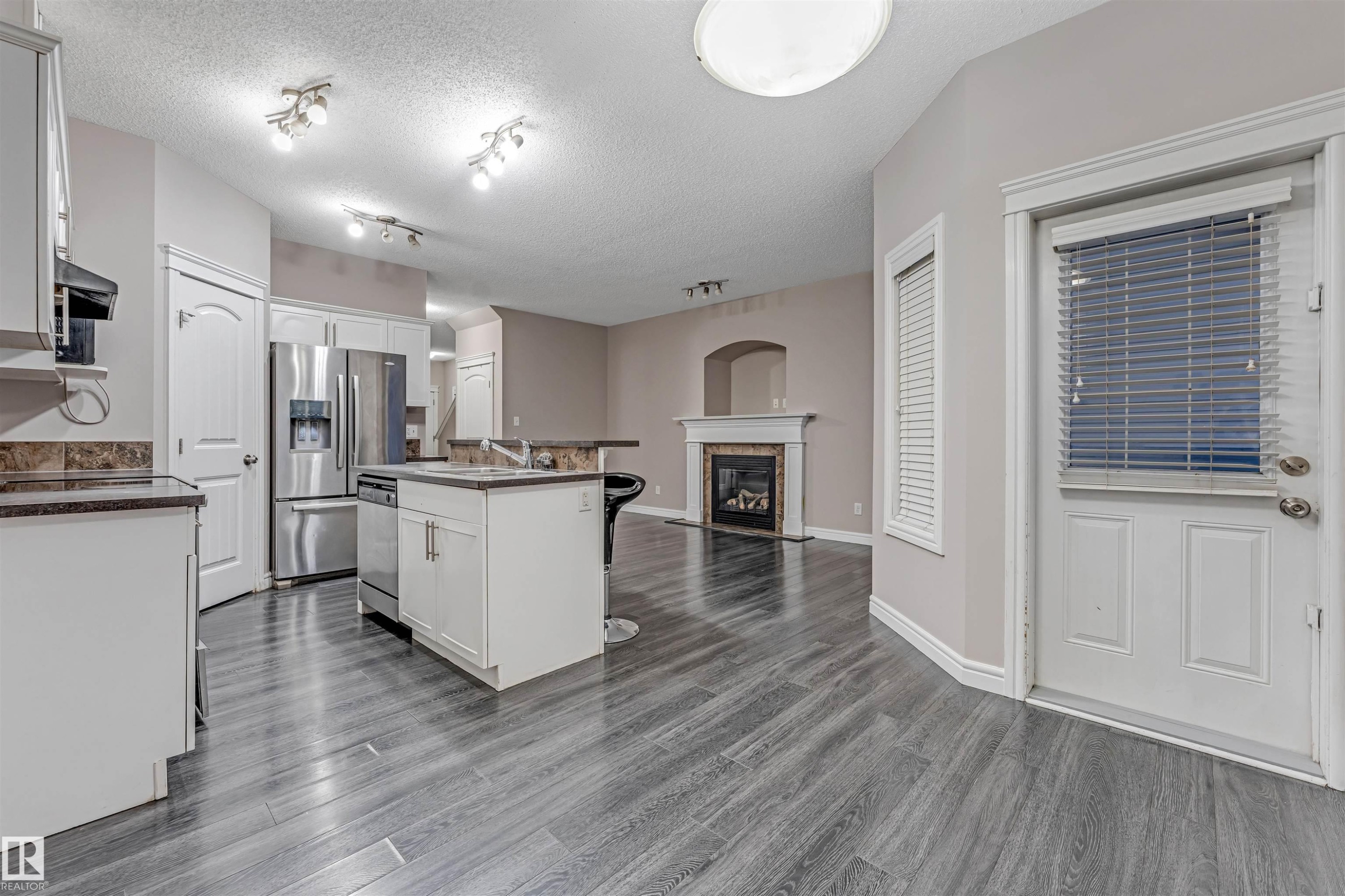 2929 16A Avenue, Edmonton, AB - Indoor Photo Showing Kitchen With Fireplace