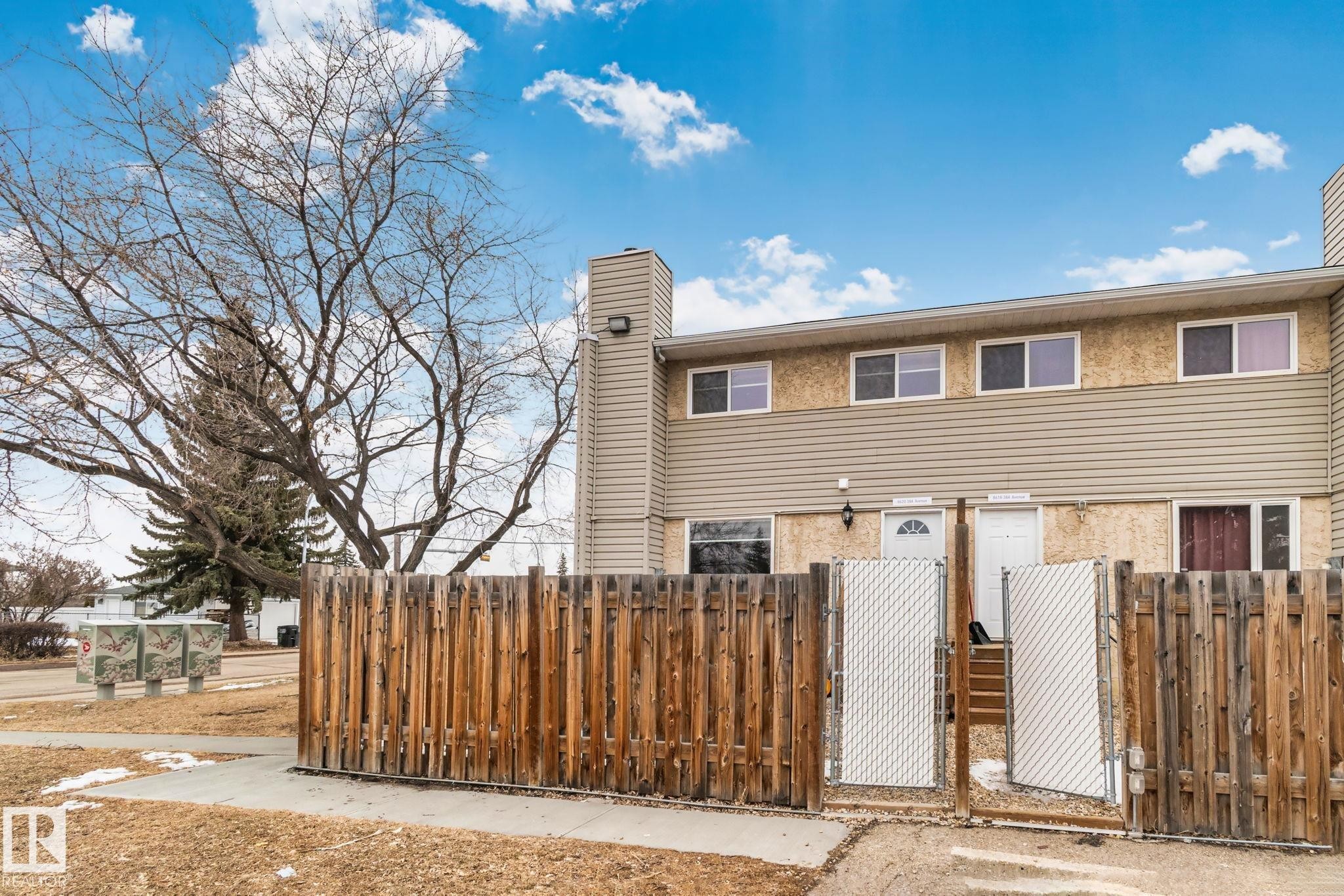 This property features a two-story exterior with siding and stucco finishes - 8620 38A Avenue, Edmonton, AB - Outdoor