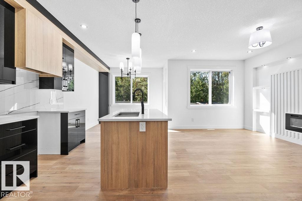 207 39 Avenue, Edmonton, AB - Indoor Photo Showing Kitchen With Fireplace