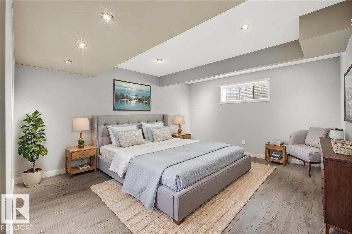 This picture is in the basement, where you can converted this room to a bedroom. This room features light grey walls and light wood-style flooring, complemented by recessed lighting in the ceiling - 17023 38 Street Nw, Edmonton, AB - Indoor Photo Showing Bedroom