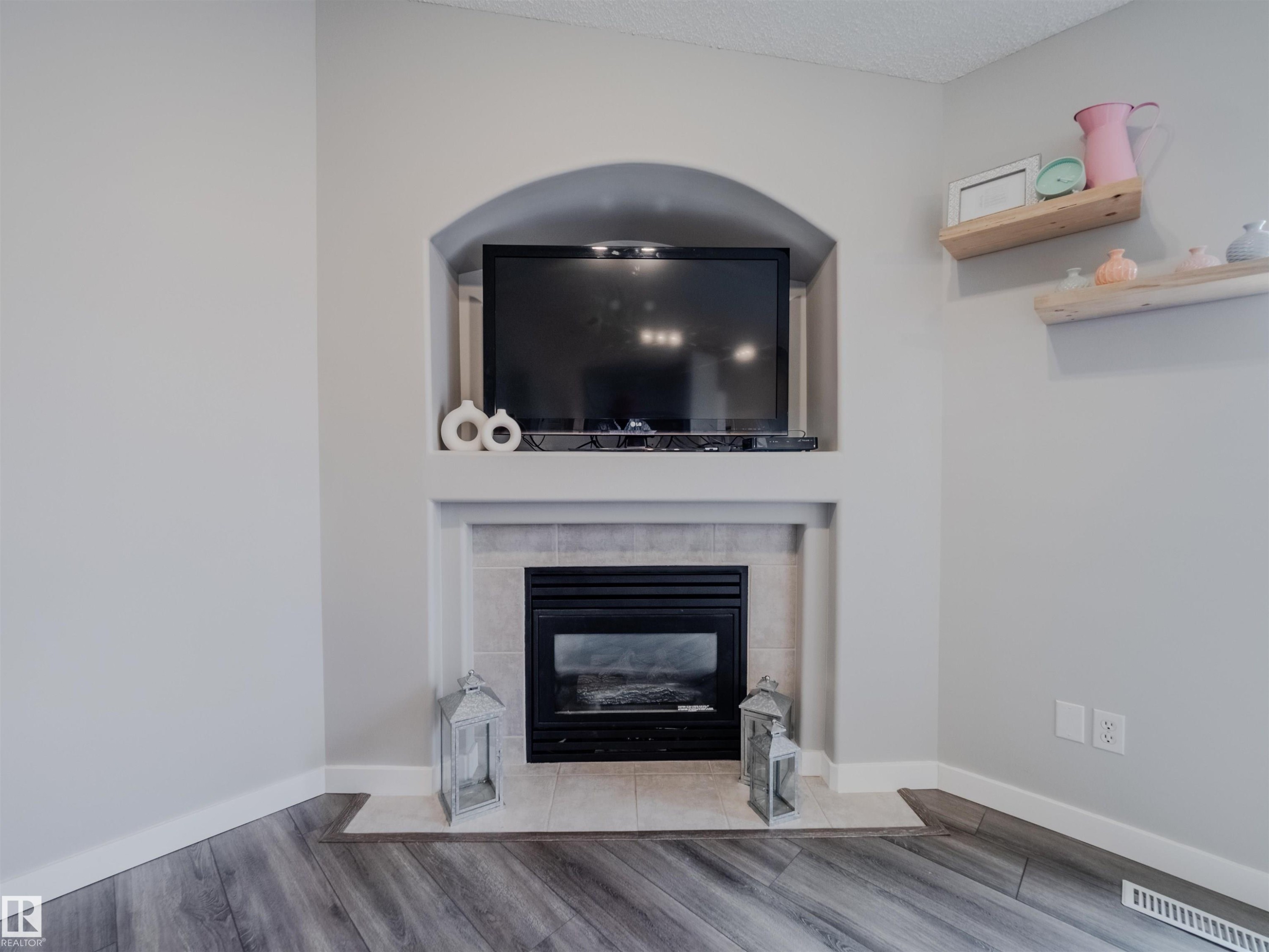 18 64 Blackburn, Edmonton, AB - Indoor Photo Showing Living Room With Fireplace
