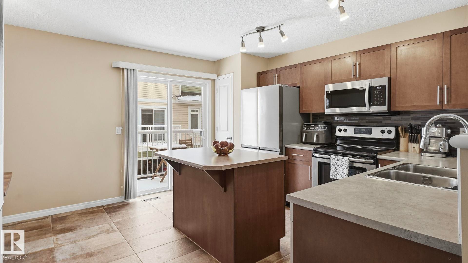 169 1804 70 St, Edmonton, AB - Indoor Photo Showing Kitchen With Double Sink
