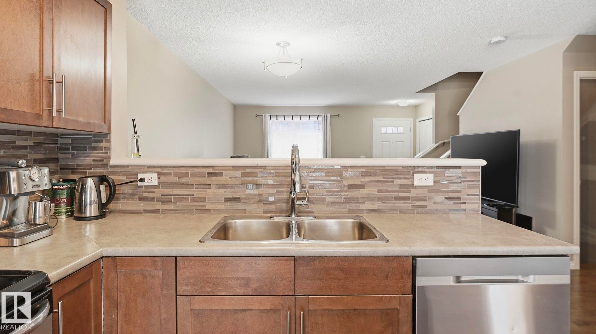 169 1804 70 St, Edmonton, AB - Indoor Photo Showing Kitchen With Double Sink