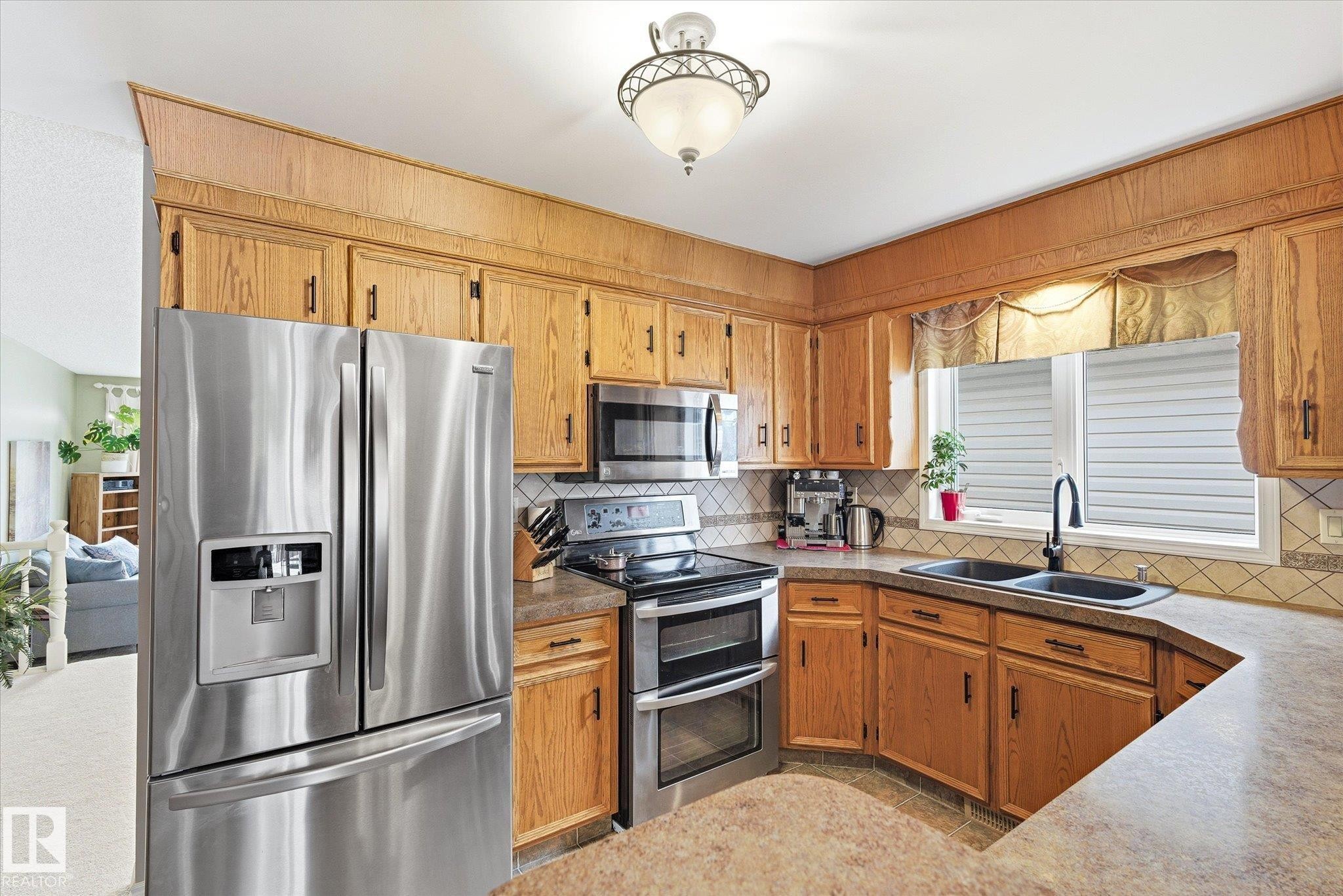8427 152B Avenue, Edmonton, AB - Indoor Photo Showing Kitchen With Double Sink