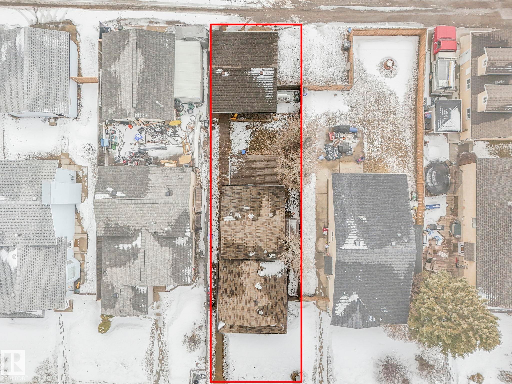 Aerial view showcasing the property's footprint, surrounded by neighboring homes and visible streets - 4105 41 Avenue, Edmonton, AB -