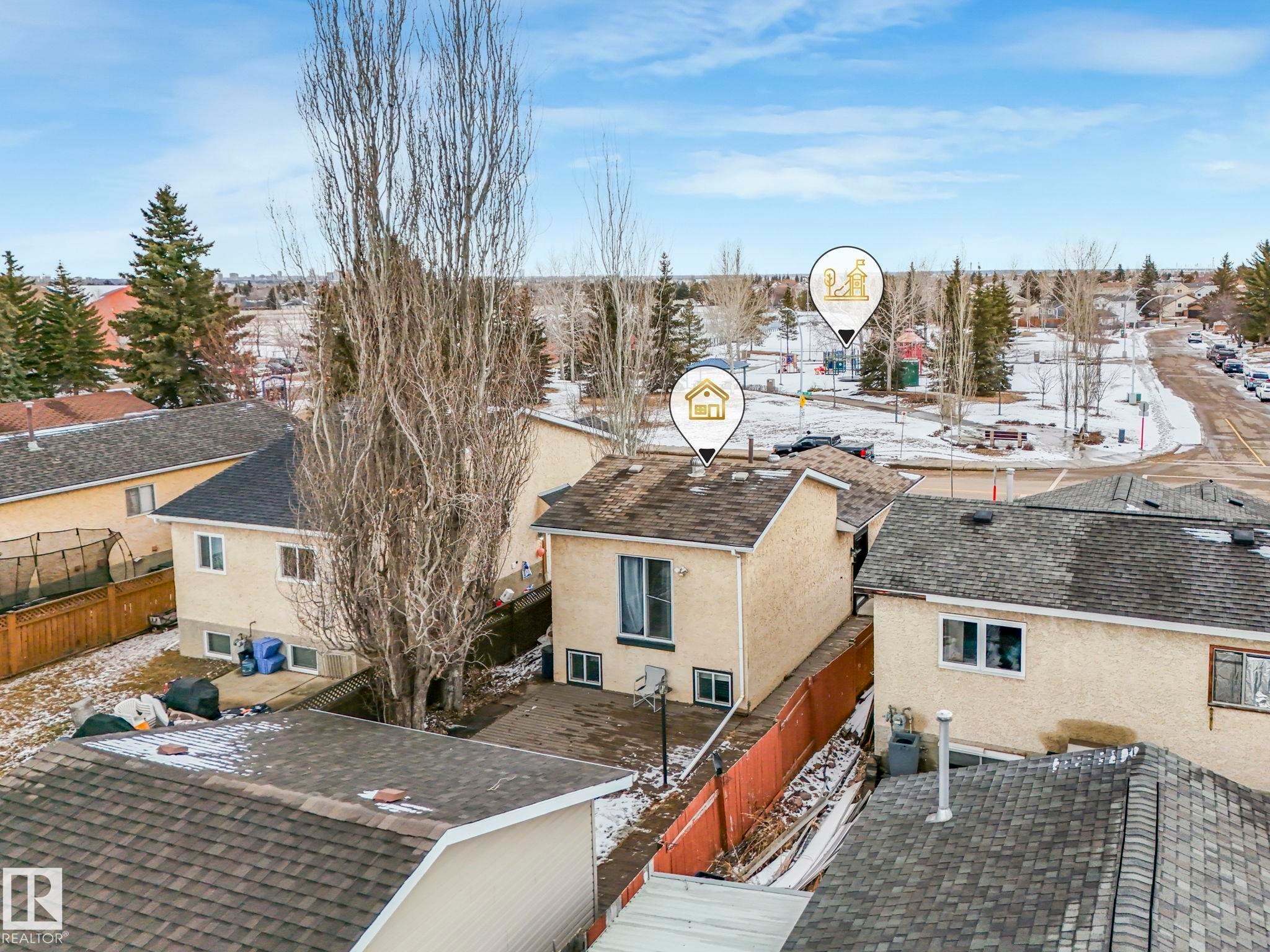 Aerial view of the property showing the exterior, a fenced yard, and a paved area - 4105 41 Avenue, Edmonton, AB - Outdoor