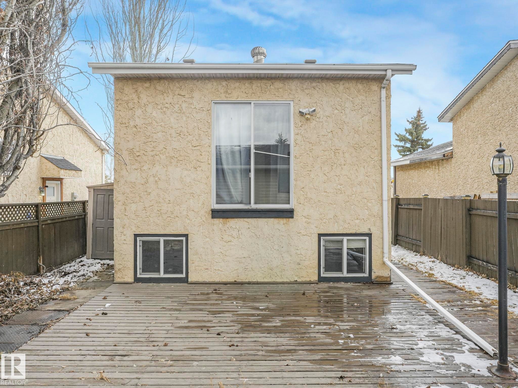 The property features a large deck, offering an ideal outdoor area - 4105 41 Avenue, Edmonton, AB - Outdoor With Exterior
