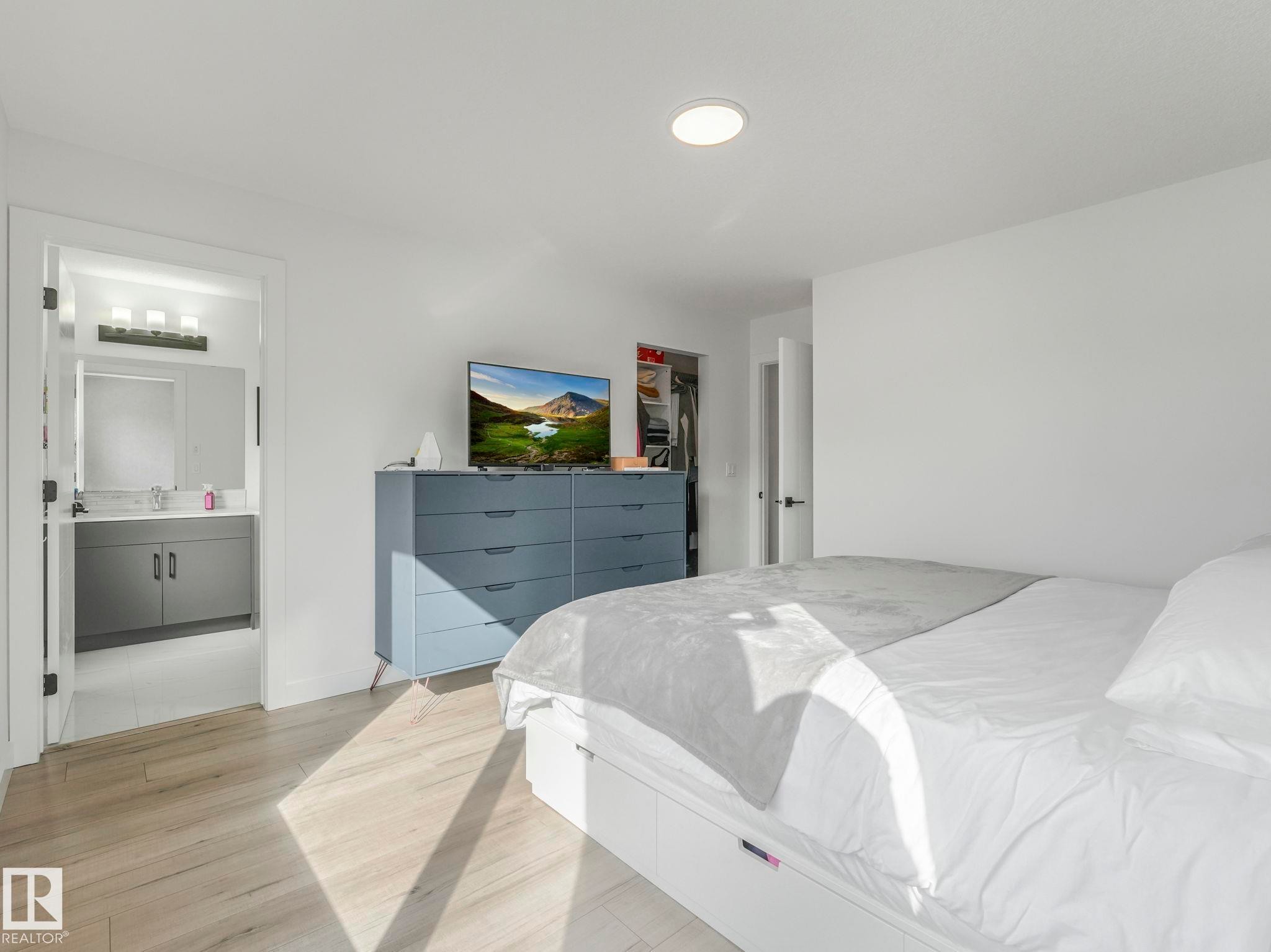 This room features light-toned flooring and white walls, creating a bright and open atmosphere - 95 1010 Rabbit Hill Road, Edmonton, AB - Indoor Photo Showing Bedroom