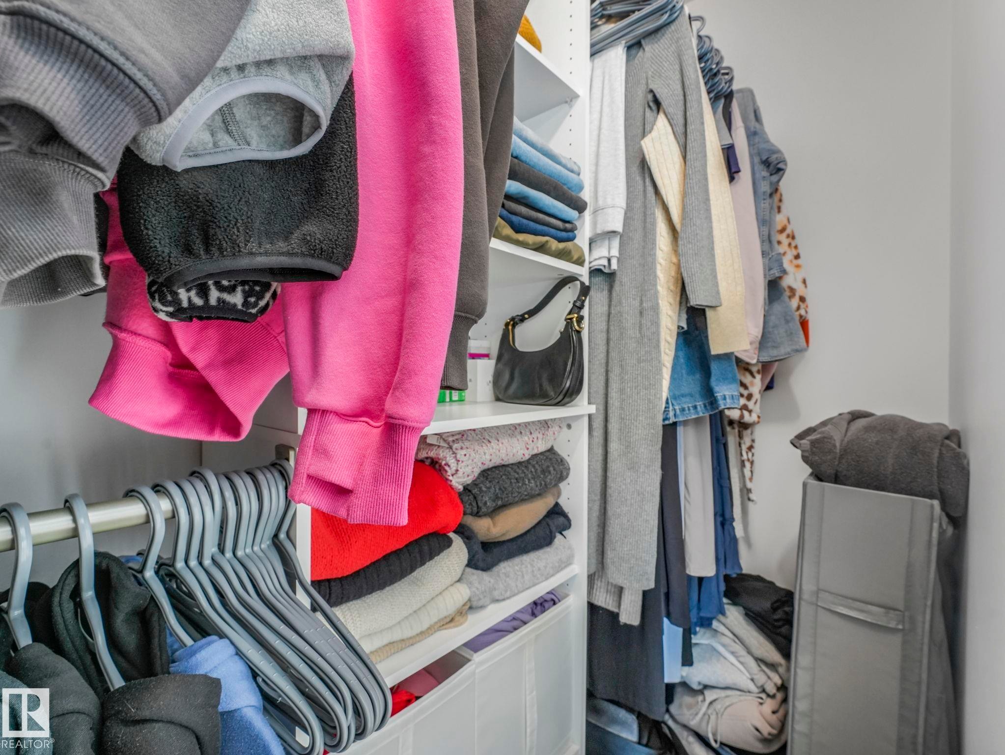 The property features a closet with built-in shelving and hanging rods - 95 1010 Rabbit Hill Road, Edmonton, AB - Indoor With Storage