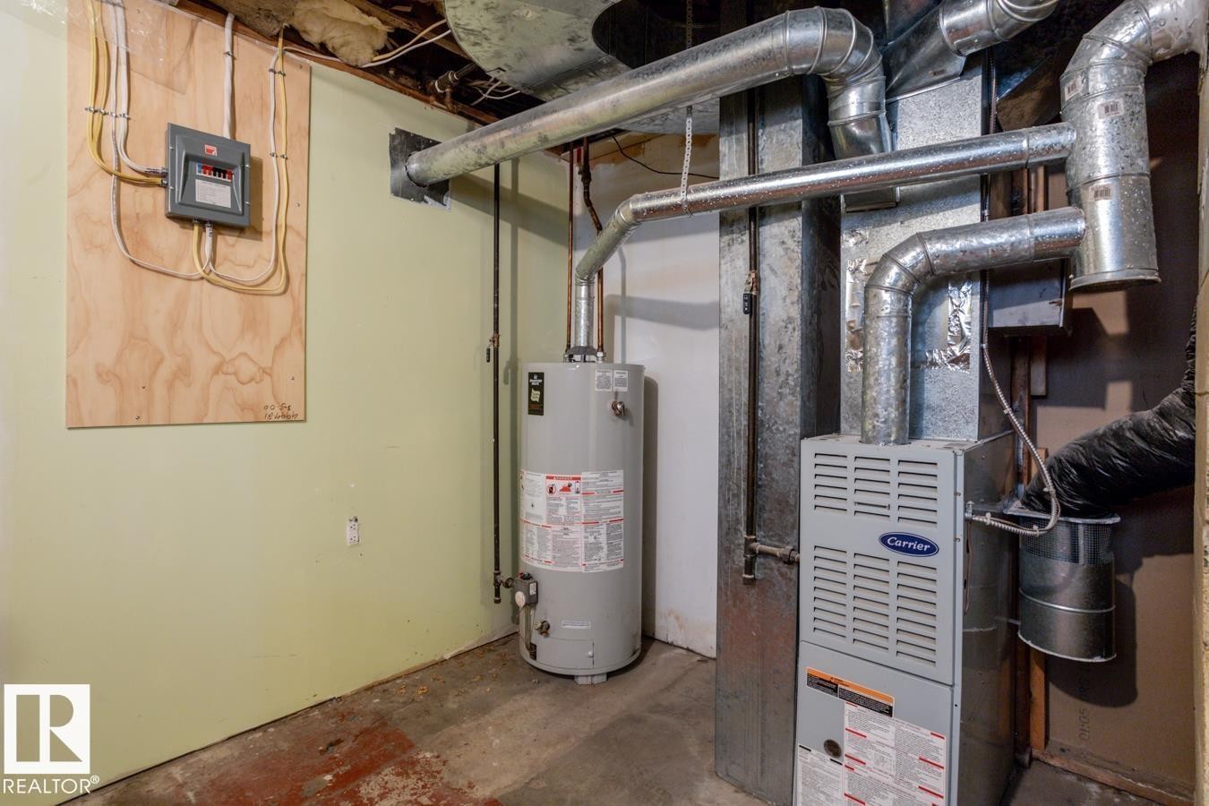 The property is equipped with NEW water heater and a Carrier furnace and sump pump - 8736 76 Avenue, Edmonton, AB - Indoor Photo Showing Basement