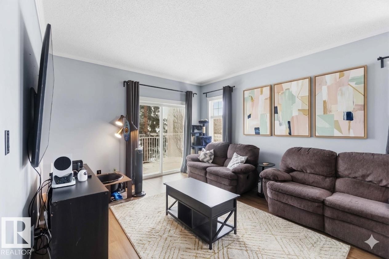 11 1179 Summerside Drive, Edmonton, AB - Indoor Photo Showing Living Room