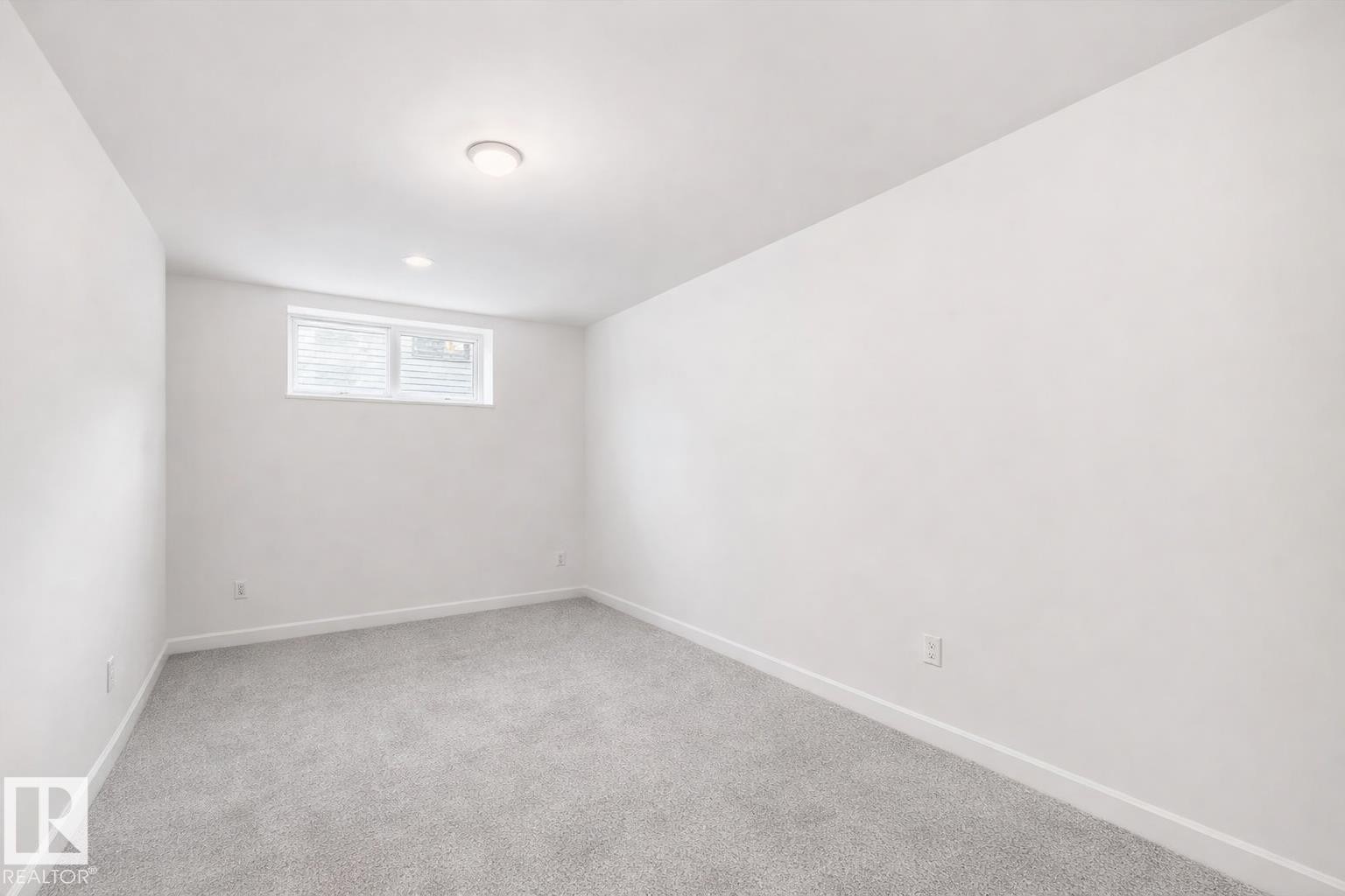 Bright room featuring white walls, light gray carpeting, and a window with blinds - 2935 Chokecherry Common, Edmonton, AB - Indoor Photo Showing Other Room
