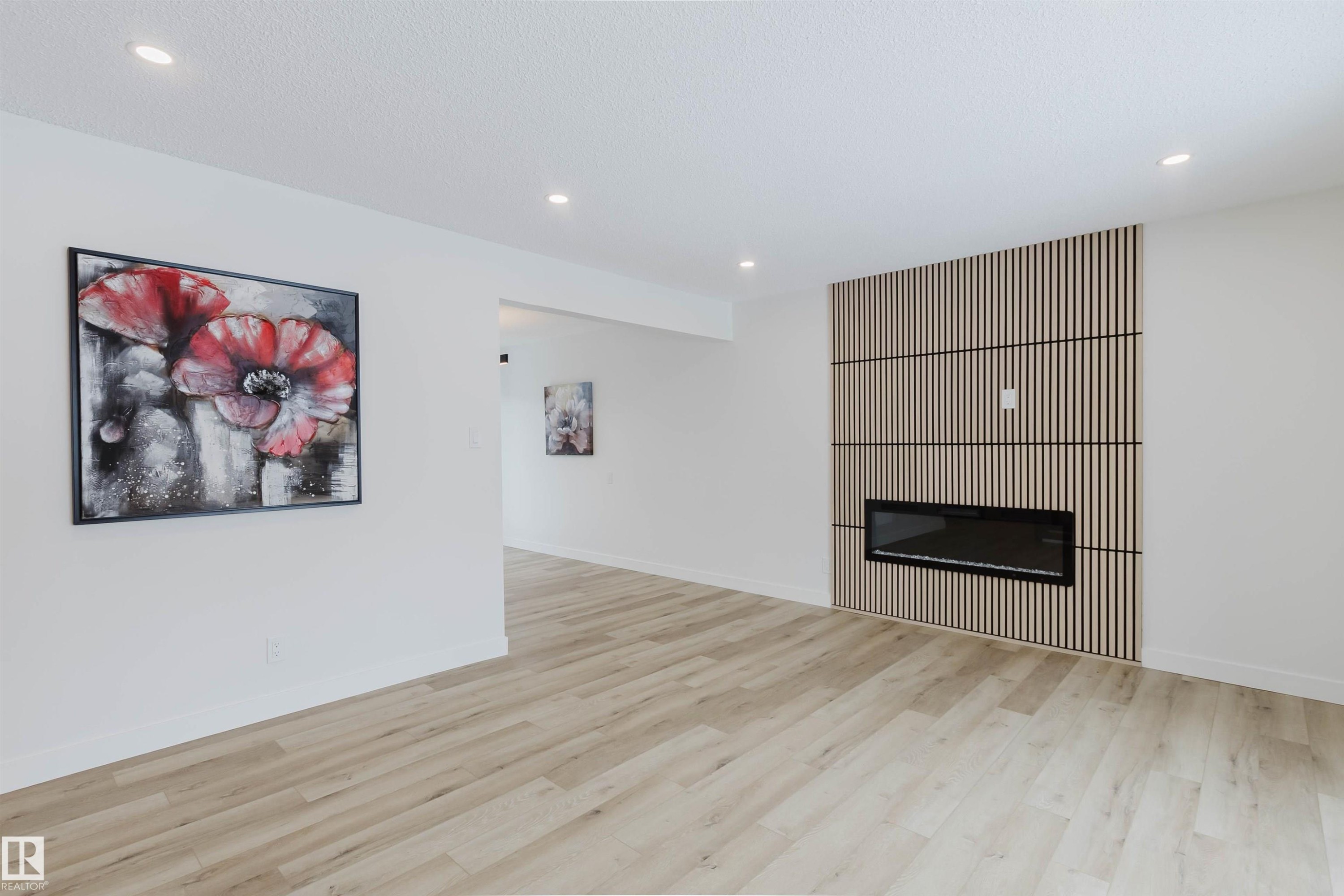 The property features light-toned flooring, white walls, and recessed lighting - 11528 42 Avenue, Edmonton, AB - Indoor