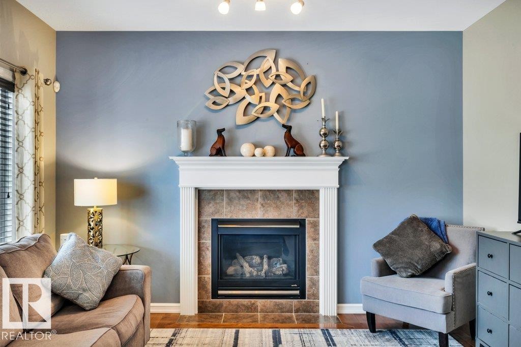 1 Rosemount, Beaumont, AB - Indoor Photo Showing Living Room With Fireplace
